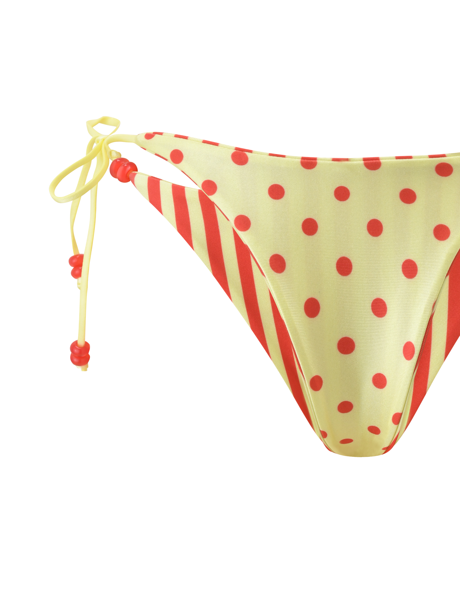 The TIGERMIST FINLEA REVERSIBLE BIKINI BOTTOM features a cheeky cut with red diagonal stripes, yellow polka dots, and yellow string ties with red beads on the left side. Displayed on a plain white background.