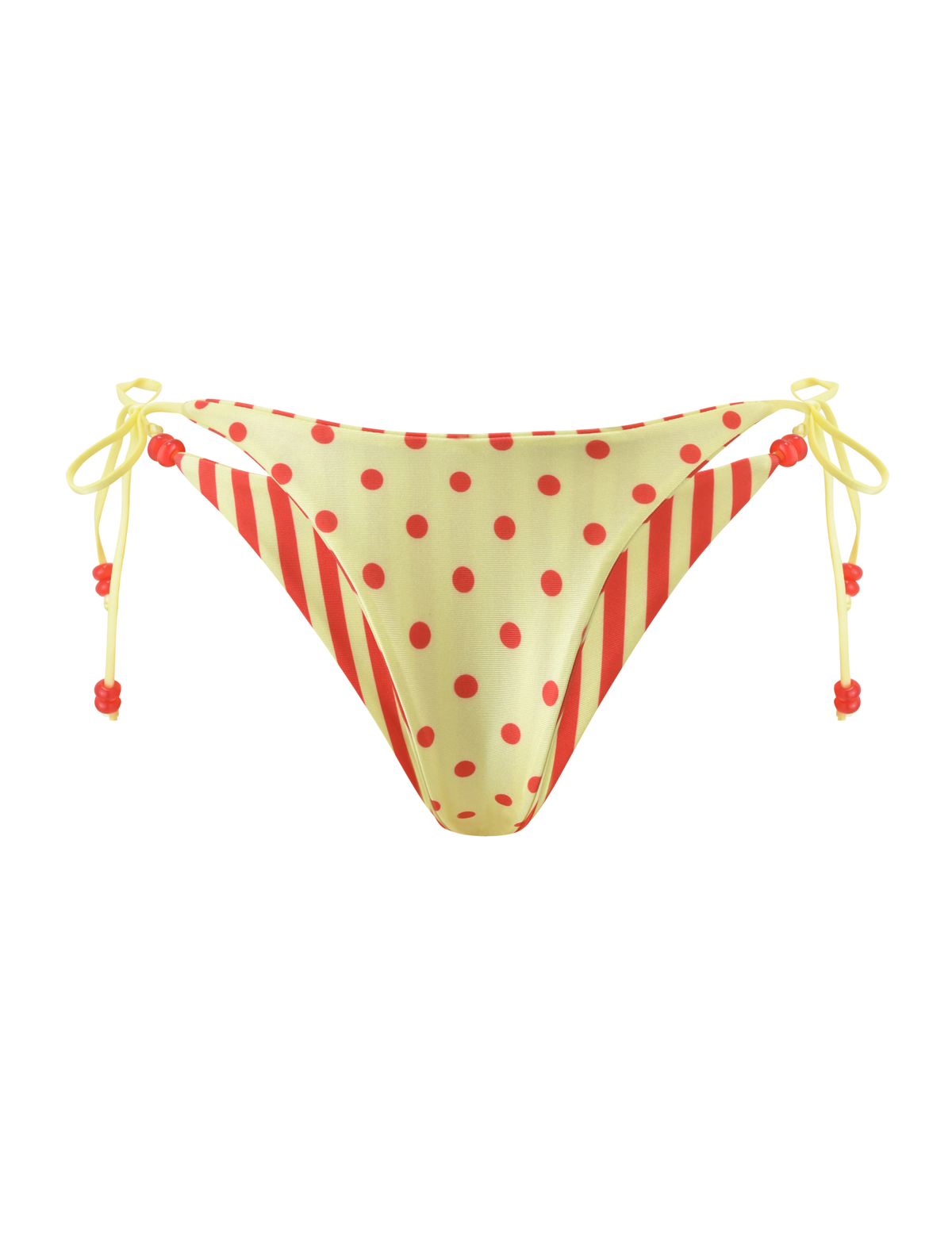 The FINLEA REVERSIBLE BIKINI BOTTOM by TIGERMIST features a cheeky cut with red polka dots and diagonal stripes on yellow, plus side string ties with red bead details for a playful touch.