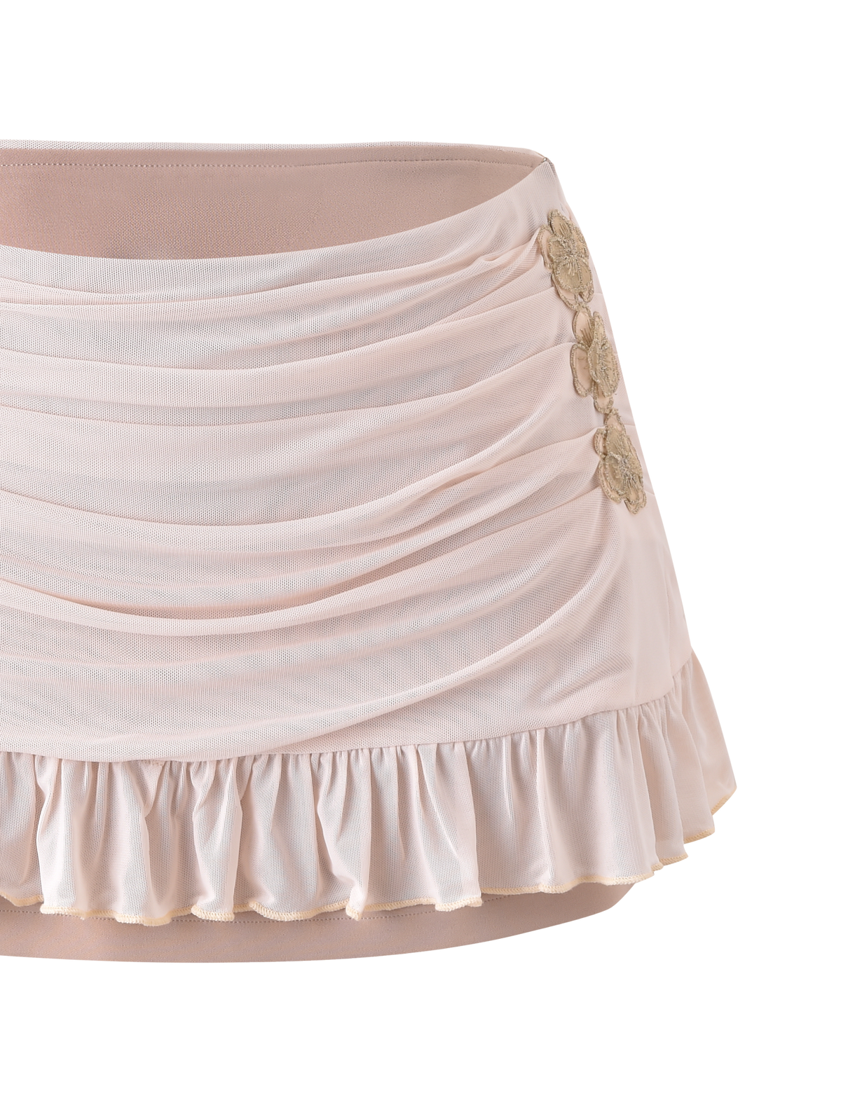 The TIGERMIST TERESE FLORAL APPLIQUE SKIRT in Tan features soft ruching, draped details, a ruffled hem, metallic gold floral appliques on the side, a smooth fitted waistband, and an elegant feminine design.