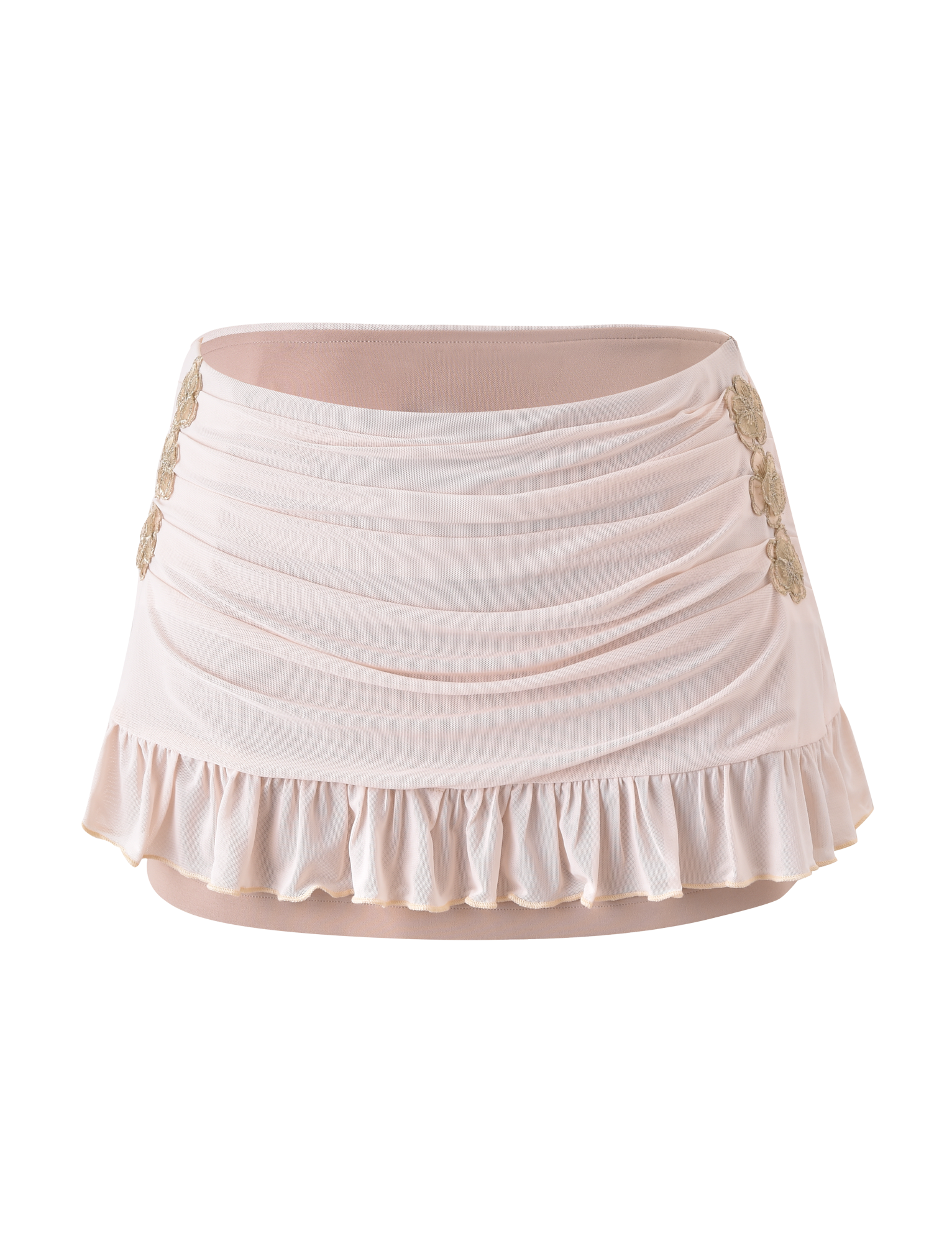 The TIGERMIST TERESE FLORAL APPLIQUE SKIRT in tan is a ruched mini skirt with ruffled hem, metallic gold floral appliques on the sides, and delicate embroidery accents, shown against a plain white background.