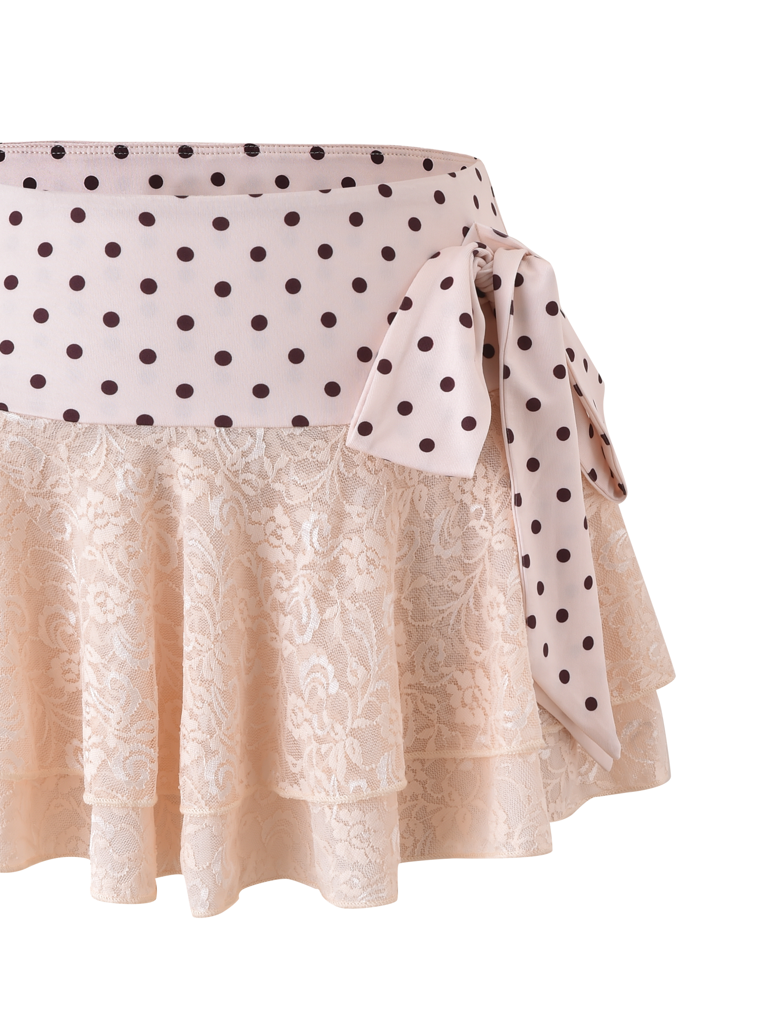 The KAYLI MINI SKIRT - CREAM by TIGERMIST features cream polka dot lace, layered ruffles, a wide light pink printed waistband, and a matching side bow for an elegant finish.