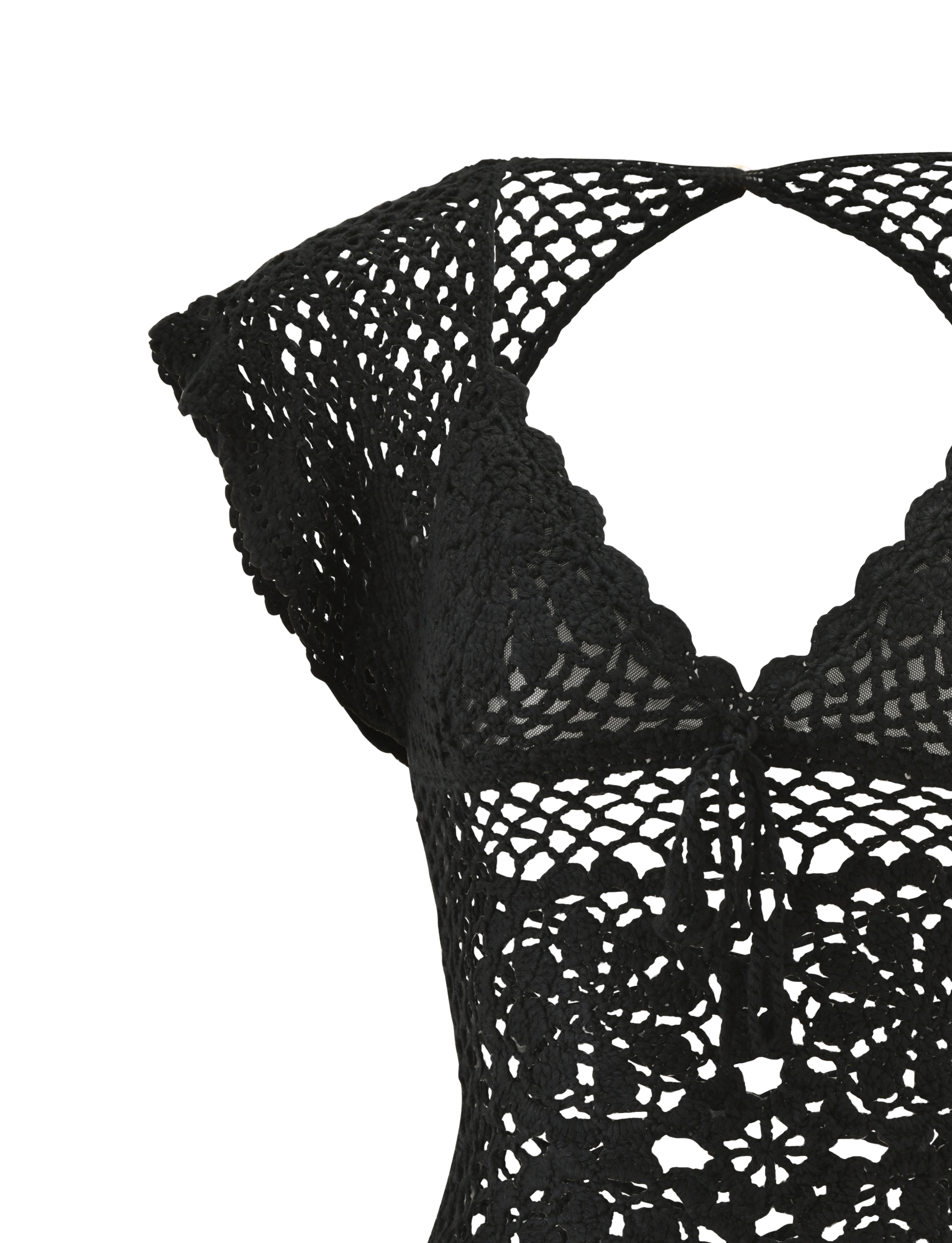 Close-up of the SASHA CROCHET TOP in black by TIGERMIST, featuring short sleeves, a scalloped neckline, openwork floral crochet, intricate stitching, resort-inspired style, and a small front-center tie detail.