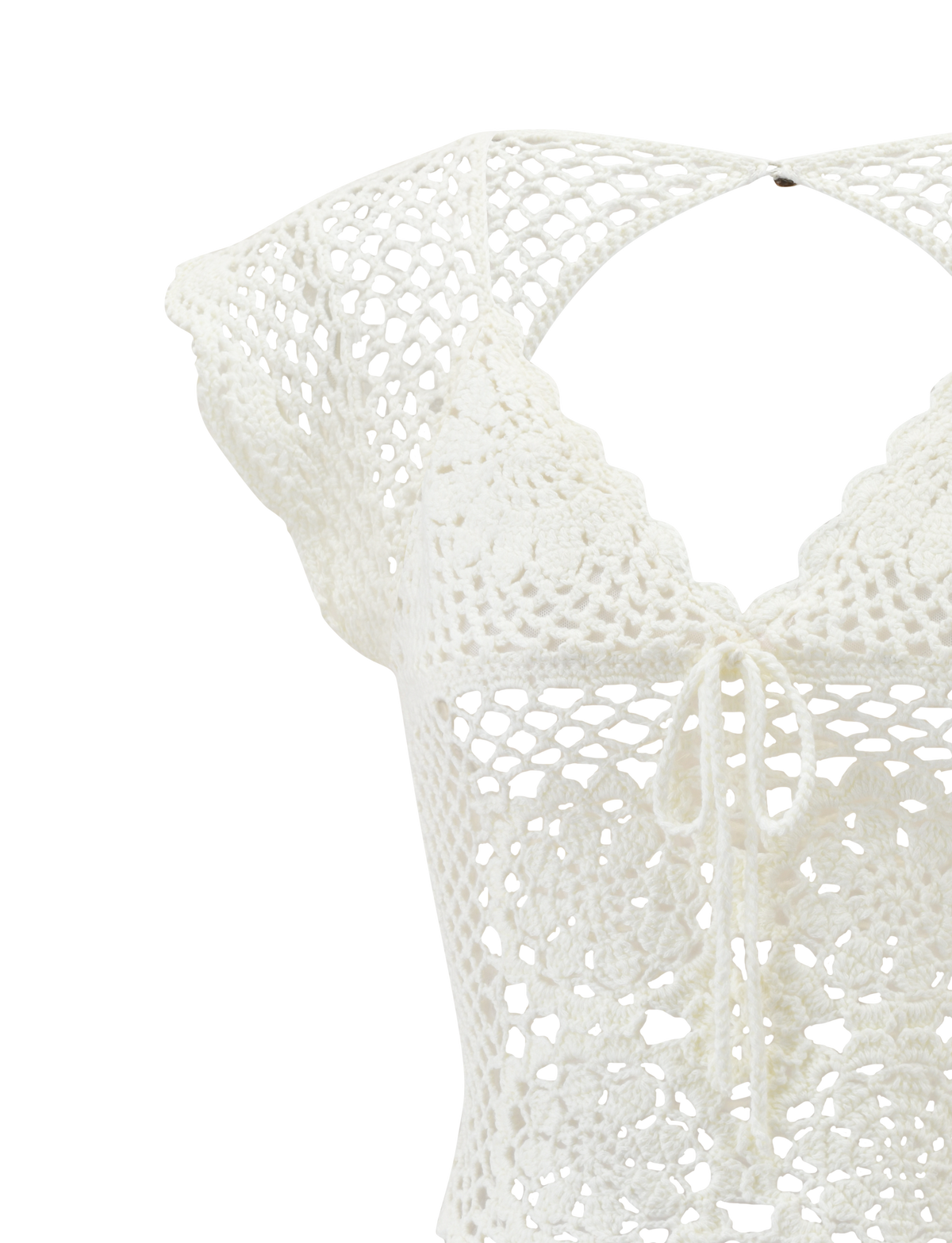 The SASHA CROCHET TOP - IVORY by TIGERMIST features corset-inspired lace-up front, scalloped cap sleeves, a V-neckline, and intricate floral crochet details that stand out on an ivory background.