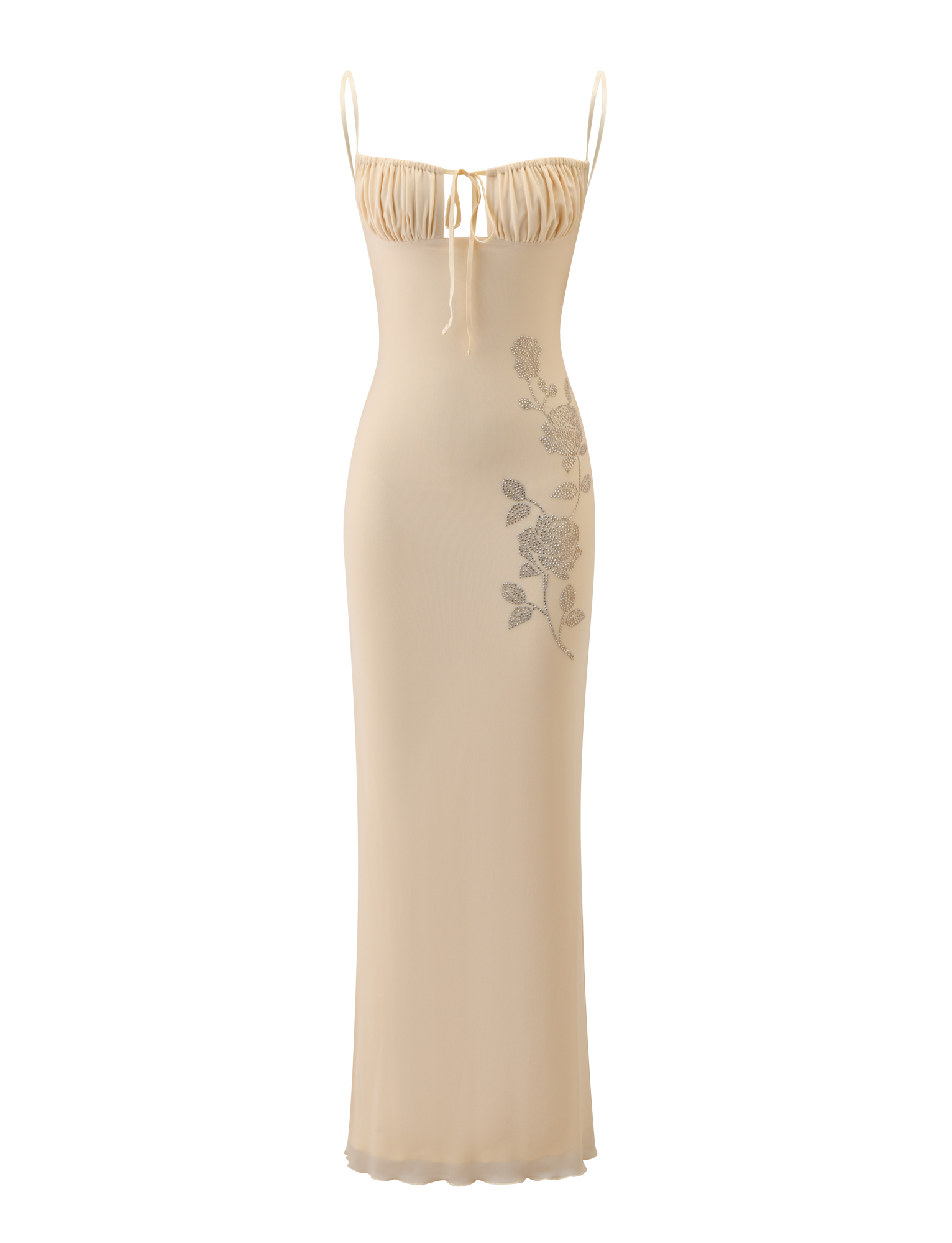 The OPHELIA MAXI DRESS - CREAM by TIGERMIST is a long, fitted slip dress with adjustable spaghetti straps, a ruched bust with tie detail, and subtle floral embellishment on the left side.