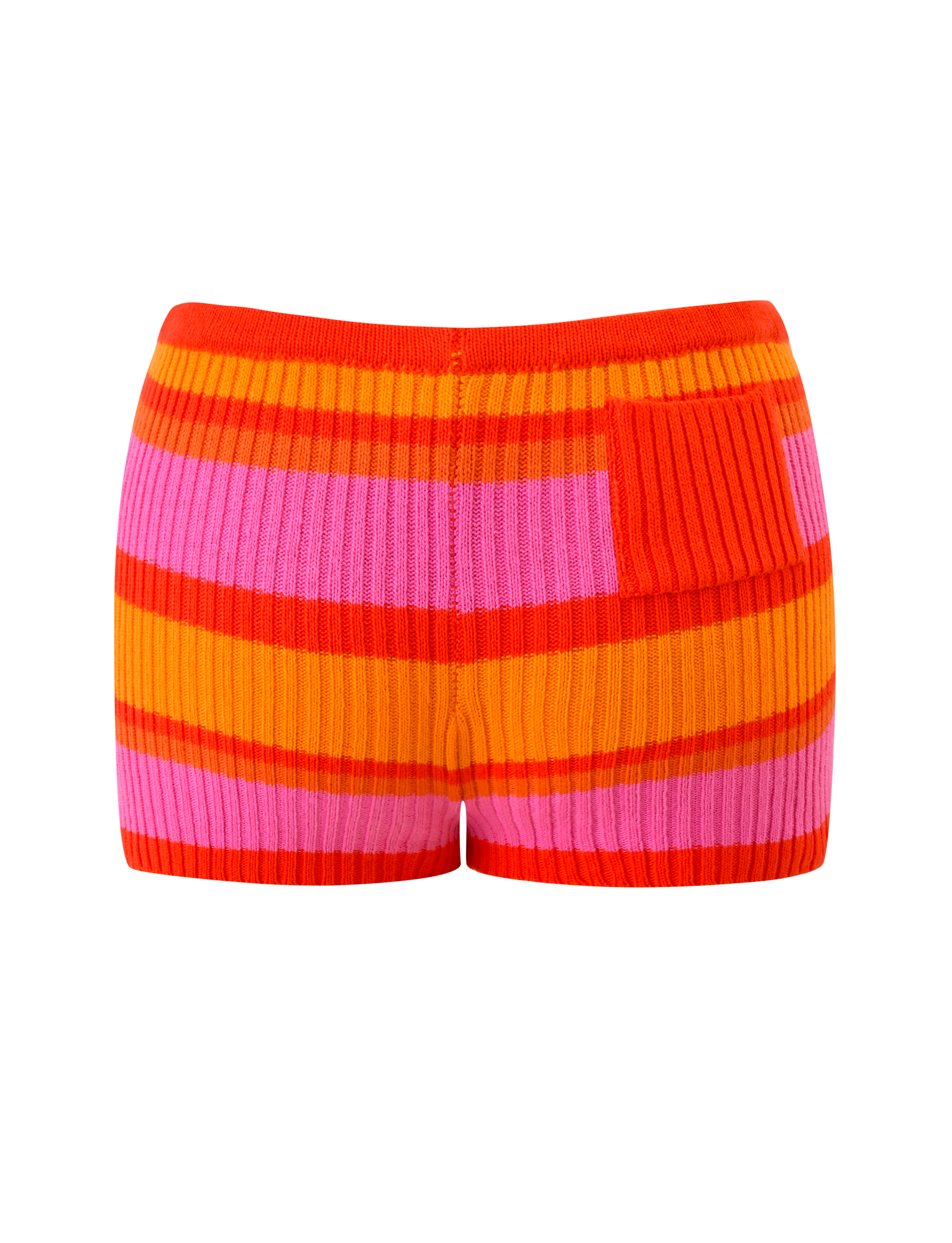 The EVERLY KNIT SHORT - SUNSET TROPICAL STRIPE by TIGERMIST features horizontal red, orange, and pink stripes with a unique pattern, fitted high-waist design, elastic waistband, ribbed texture, and a small textured patch.