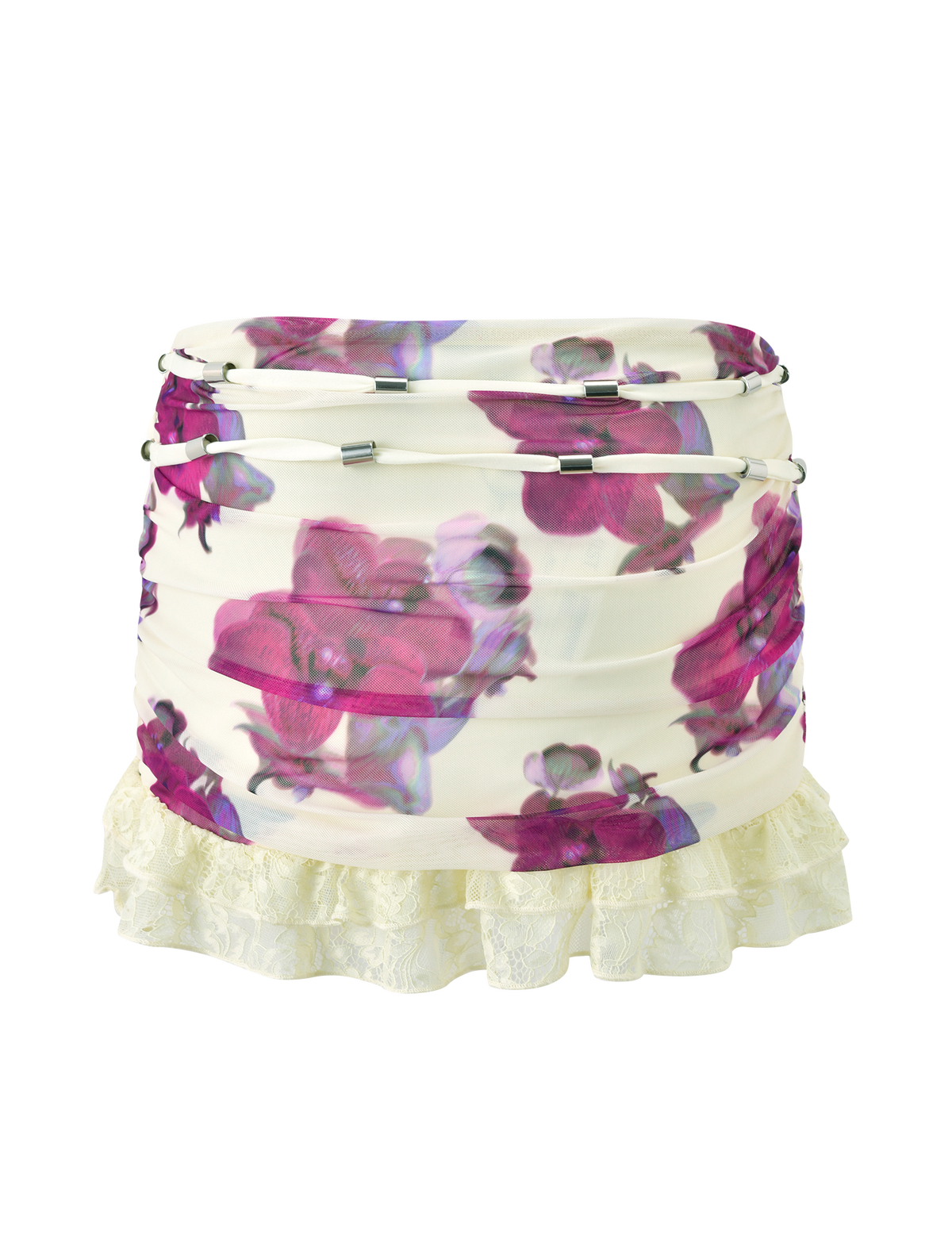 The LILIAH MINI SKIRT - ORCHID HAZE by TIGERMIST features a white ruched design with purple and pink orchid print, silver drawstring accents, and a cream lace ruffle hem.
