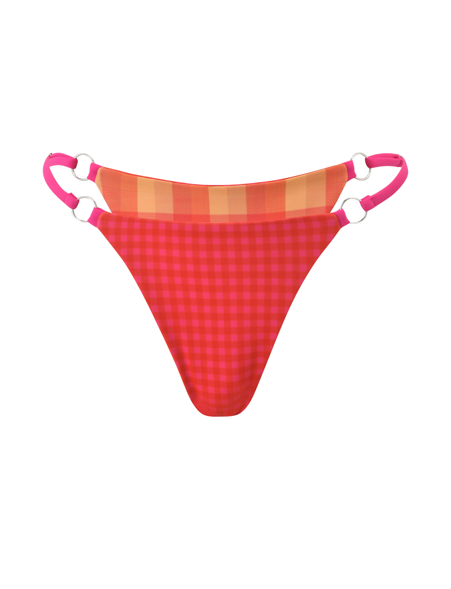 The AYANNA REVERSIBLE BIKINI BOTTOM by TIGERMIST pairs red and pink gingham with orange and yellow plaid accents, pink double adjustable side straps with silver rings, and cheeky coverage. Photographed on a plain white background.