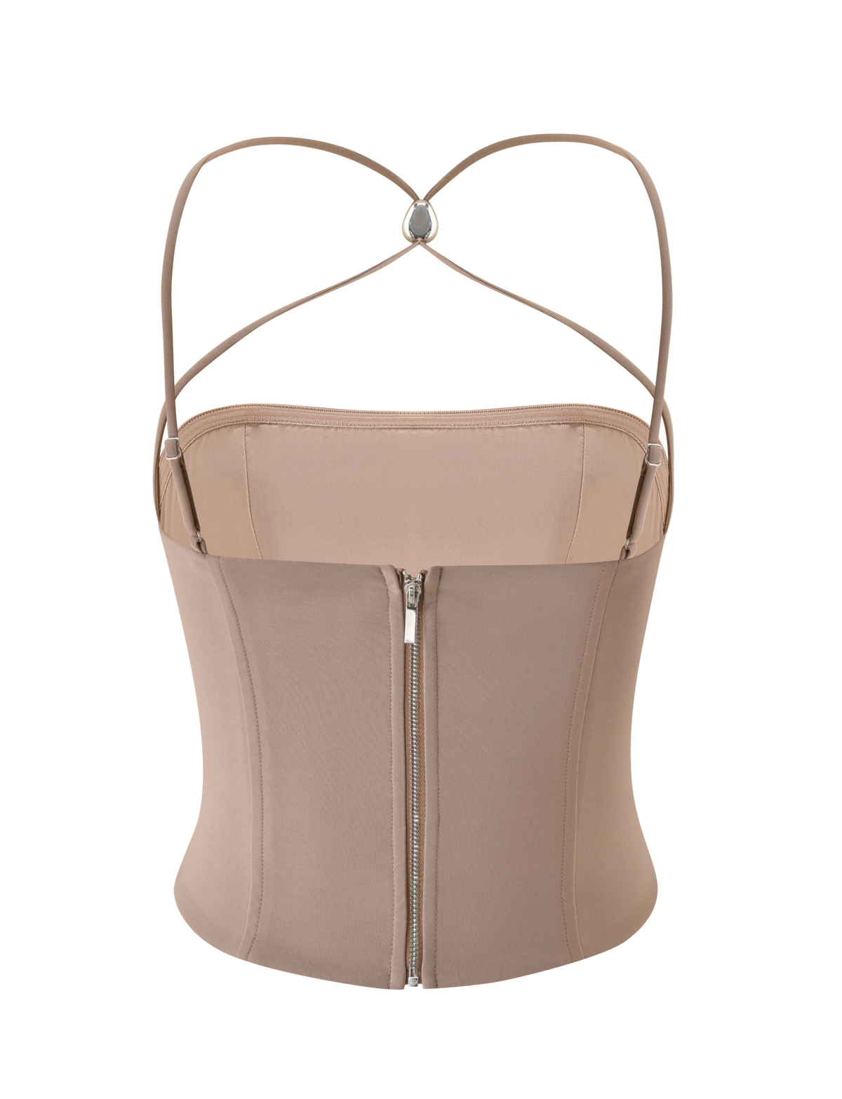 The TAMORA CORSET TOP by TIGERMIST is a taupe, fitted top with thin adjustable straps, a sweetheart neckline, and a visible silver back zipper. The 90’s-inspired straps form a heart shape with a ring at the crossing on the back.