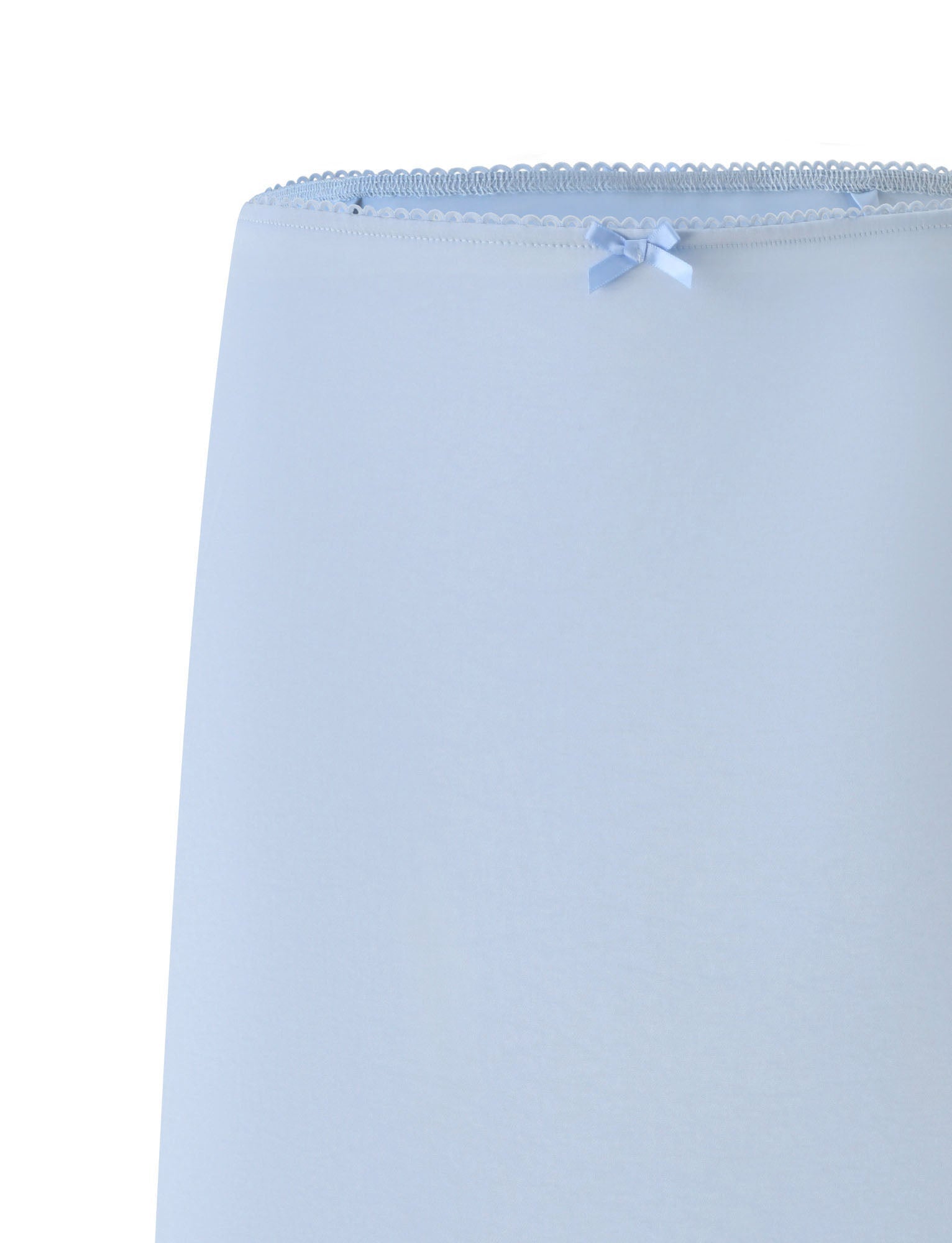 The image displays a close-up of the upper section of the LEISEL SKIRT - BABY BLUE by TIGERMIST, highlighting its delicate light blue fabric, which features a small blue bow and an elegant scalloped lace trim along the top edge. These charming details add an elegant touch to this baby blue lace trim skirt.