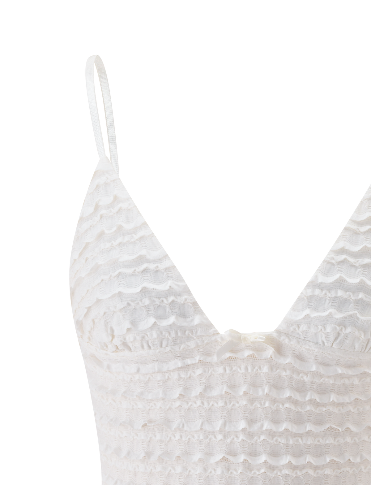 Close-up of the TIGERMIST ZORA TOP in cream, featuring adjustable straps, a scalloped textured lace pattern, and a small white bow below the V-neckline. Set against a plain white background.