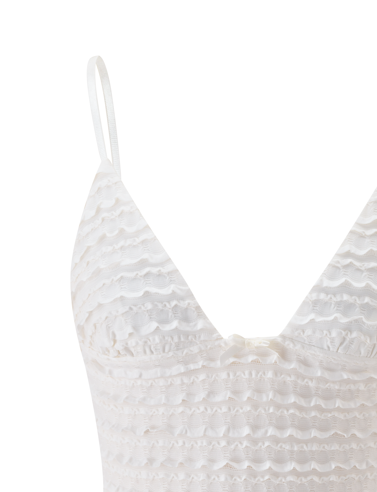 Close-up of the TIGERMIST ZORA TOP in cream, featuring adjustable straps, a scalloped textured lace pattern, and a small white bow below the V-neckline. Set against a plain white background.