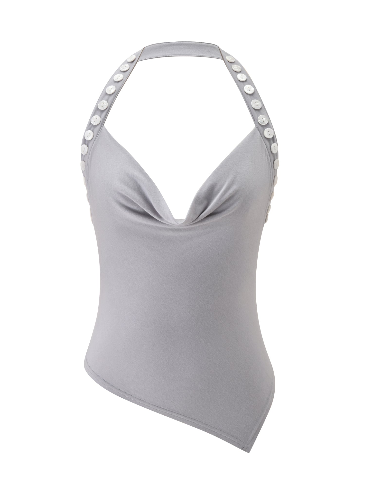 The SUKI TOP - GREY by TIGERMIST is a light gray, sleeveless halter crafted from soft jersey, showcasing a cowl neckline, decorative white buttons along the straps, and an asymmetrical hem.