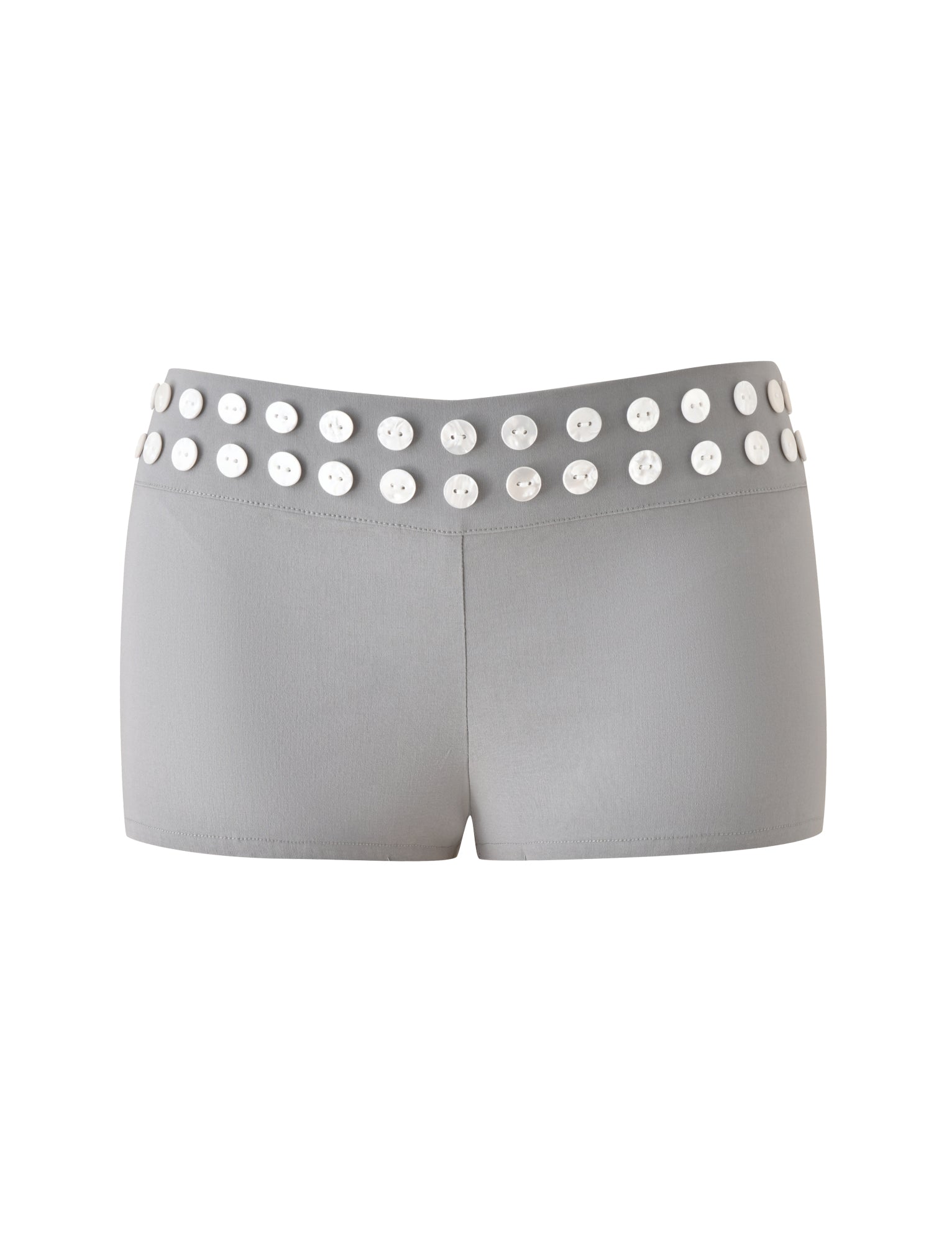 The SUKI SHORT - GREY by TIGERMIST is a grey, tailored mini short with a low-rise silhouette, featuring two rows of large faux shell buttons at the waistband, shown against a plain white background.