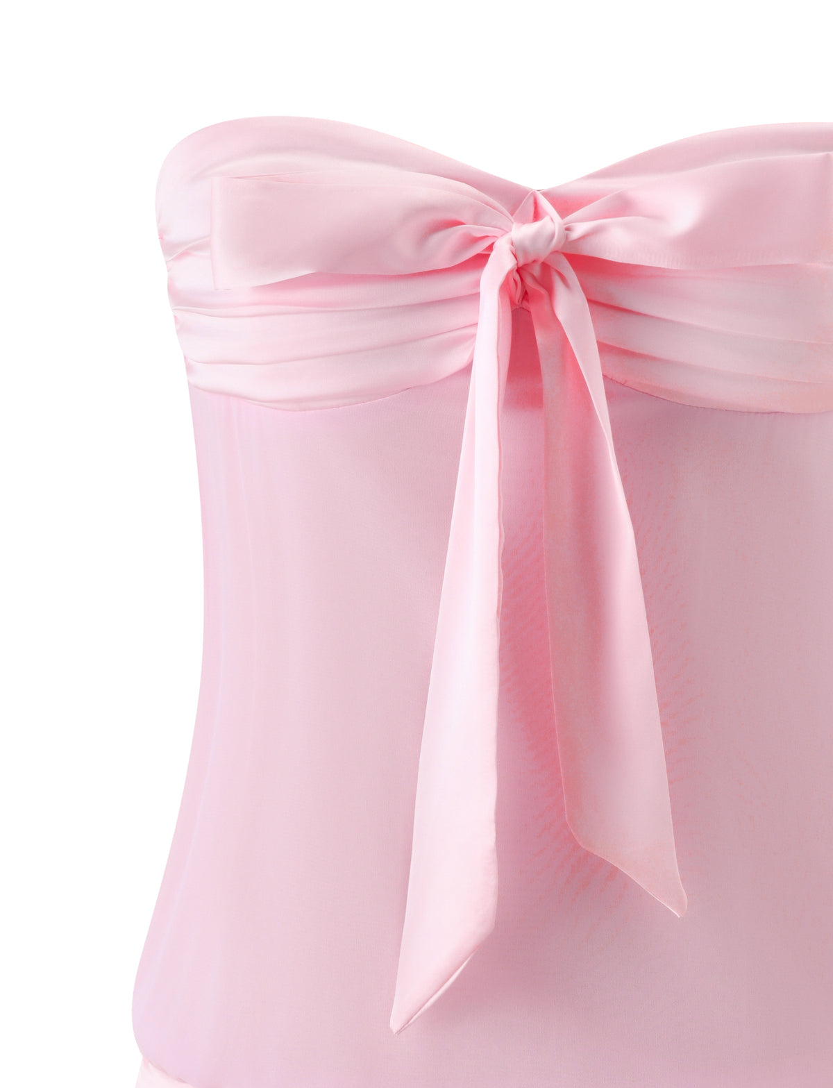 A close-up of the TIGERMIST LUX MINI DRESS - BALLET PINK, a strapless light pink satin mini dress with a sheer overlay and a satin bow at the bodice center.