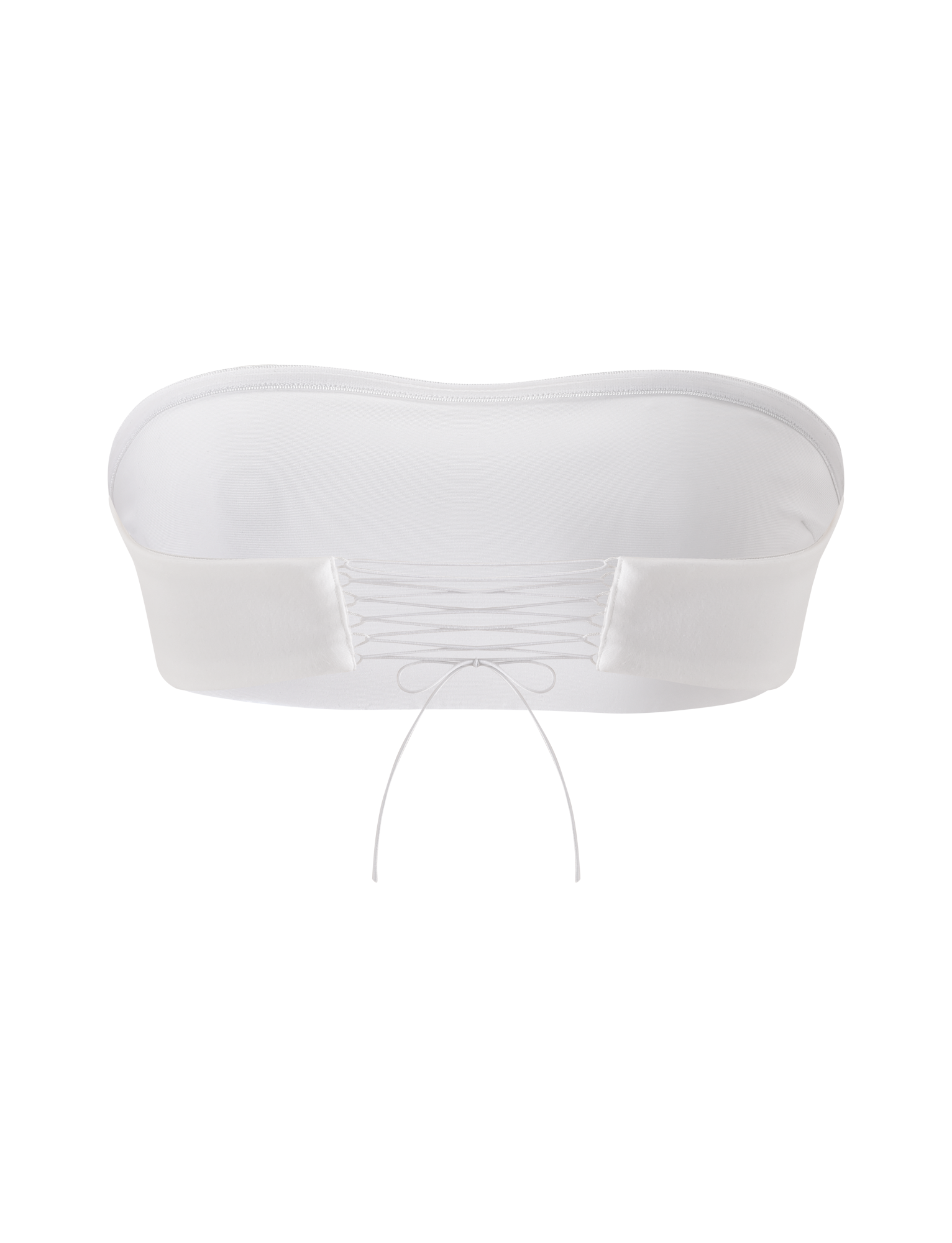 The TIGERMIST PILAR BANDEAU in white is a cropped, strapless top made from soft ponte jersey with a smooth front and an adjustable lace-up back, displayed on a plain white background.