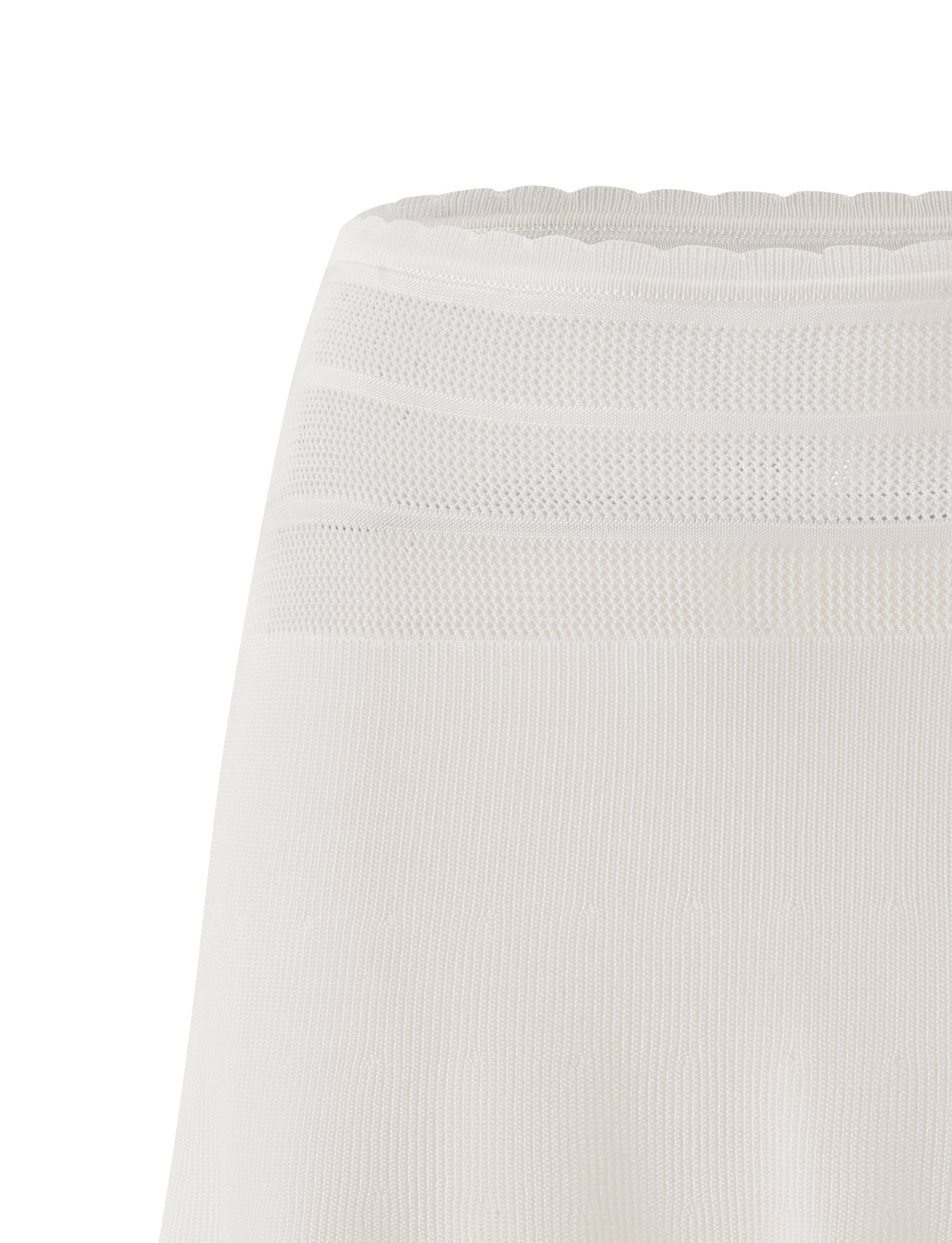 A close-up of the TIGERMIST DENI MINI SKIRT in cream highlights its white textured fabric with mesh and ribbed patterns near the waistband, showcasing the subtle elegance characteristic of this stylish mini skirt.
