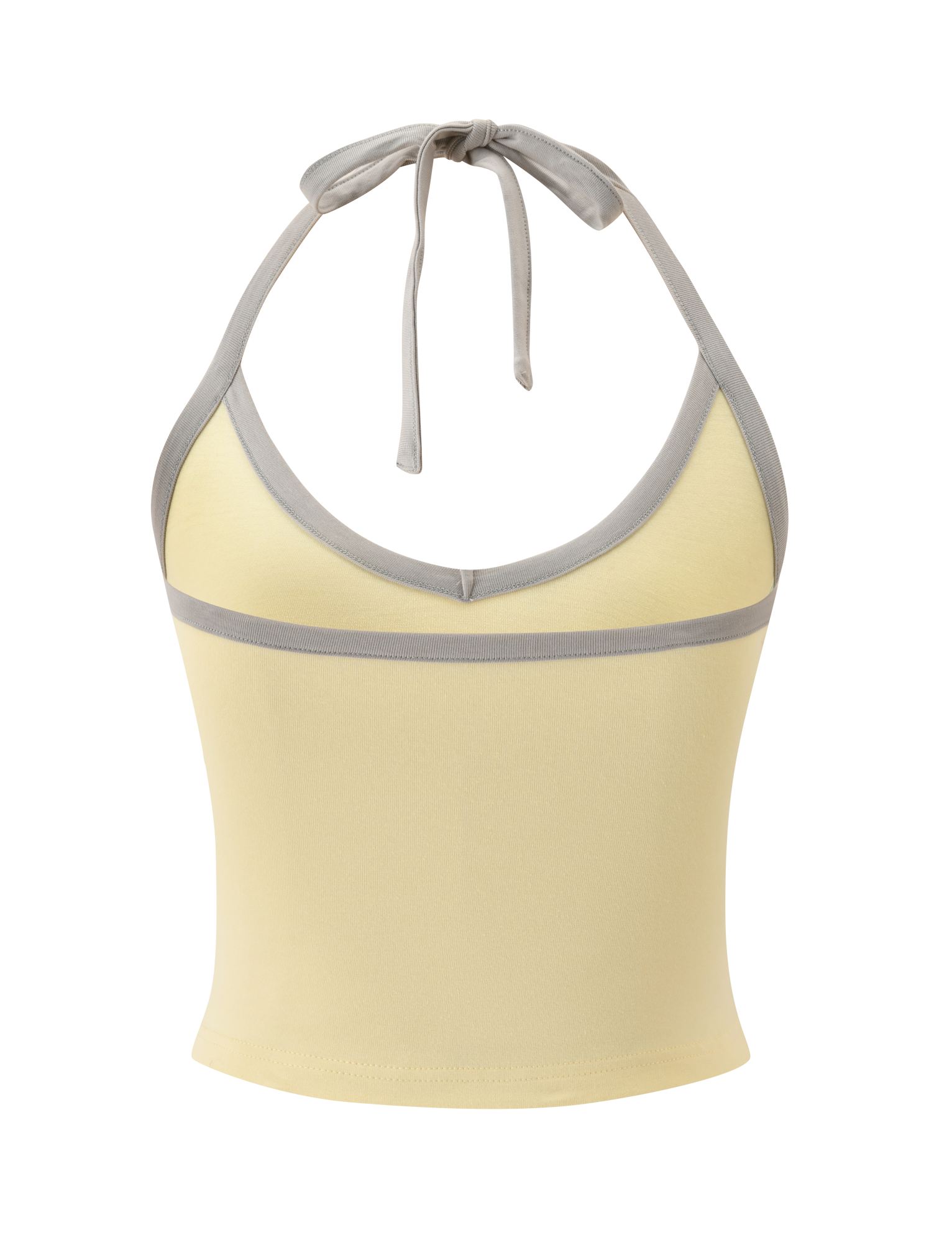 The ALYSIA TOP - BUTTER by TIGERMIST is a sleeveless, light yellow halter with a plunging V-neckline, grey trim on the edges and underbust, and a neck tie.