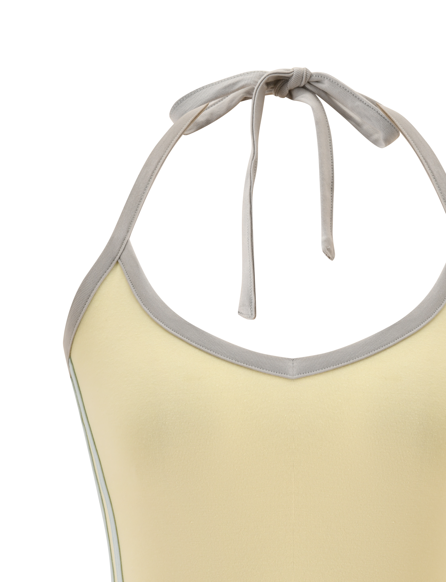 Close-up of the TIGERMIST ALYSIA TOP in Butter—a sleeveless, light yellow halter top with grey trim, neck tie, and subtle v-neckline—shown against a white background.
