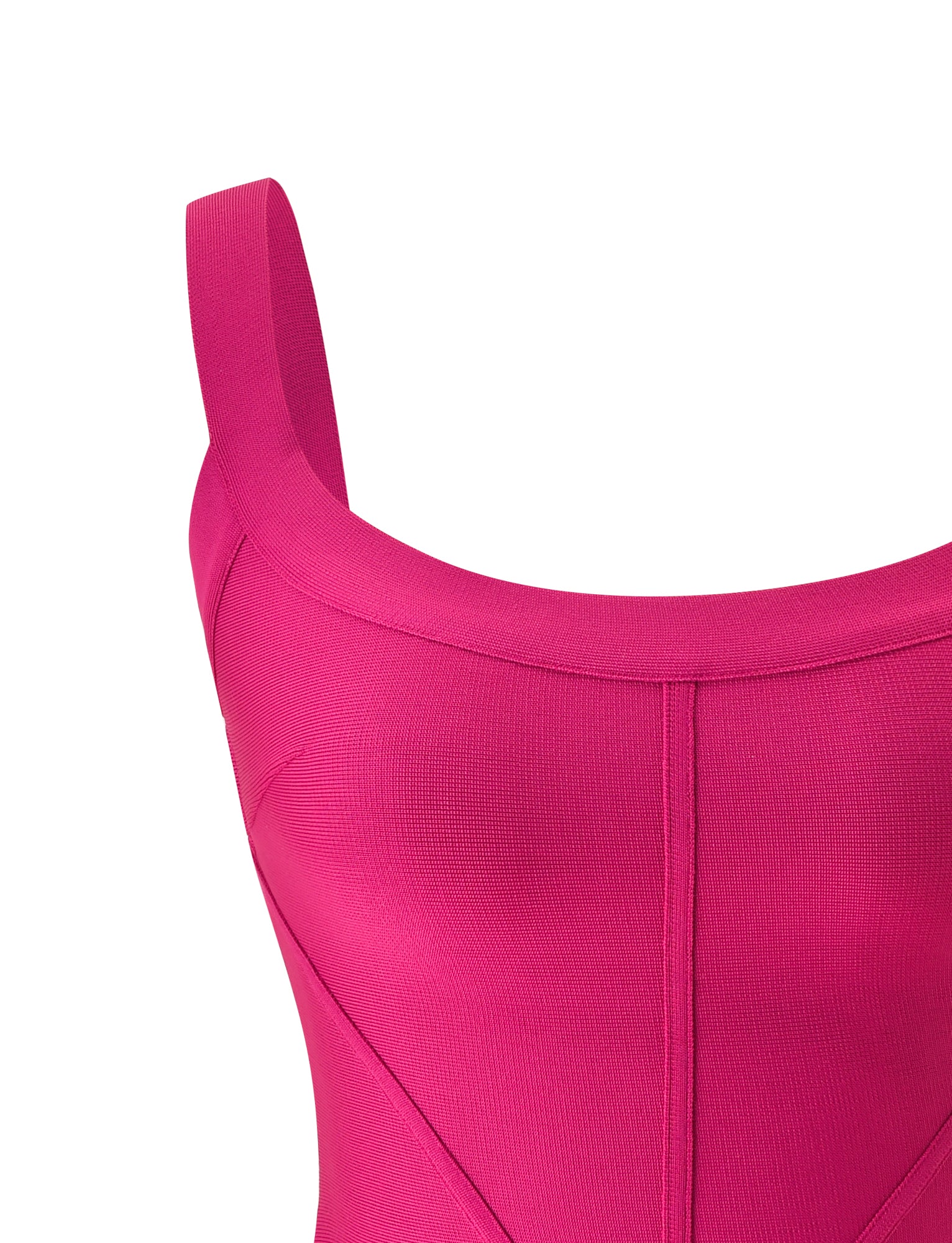 Close-up of the EVA BANDAGE TOP – MAGENTA by TIGERMIST, styled as a sleeveless, fitted dress. The top features a bright magenta hue, low scoop neckline, visible seam detailing on the bodice, and showcases its signature bodycon fit.