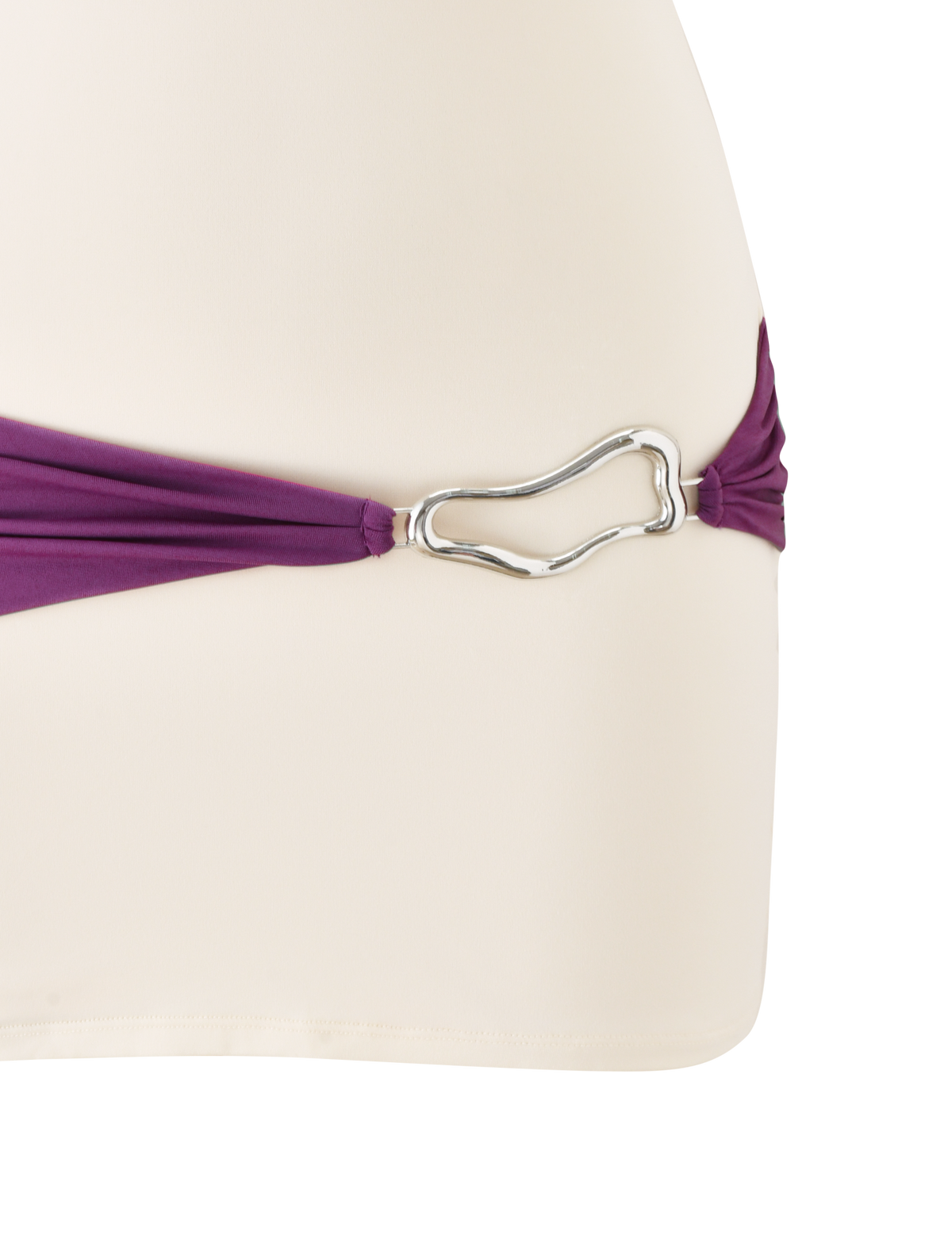 A close-up of the TIGERMIST EOS MINI DRESS in cream and dusty lilac, featuring a purple strap with a silver buckle detail at the hip.