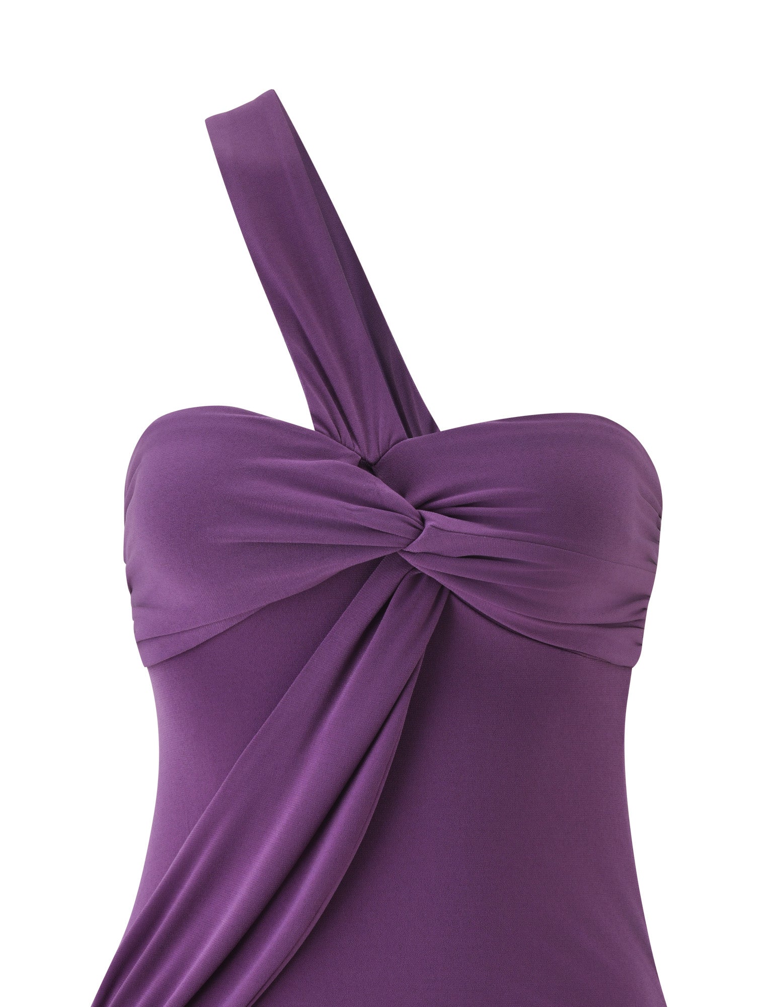 The MAIZY MINI DRESS - PLUM by TIGERMIST is a mini dress with a one-shoulder design and a twisted knot detail at the front, featuring draped fabric that falls diagonally from the knot. Its smooth, slightly shiny material creates an elegant and modern silhouette.