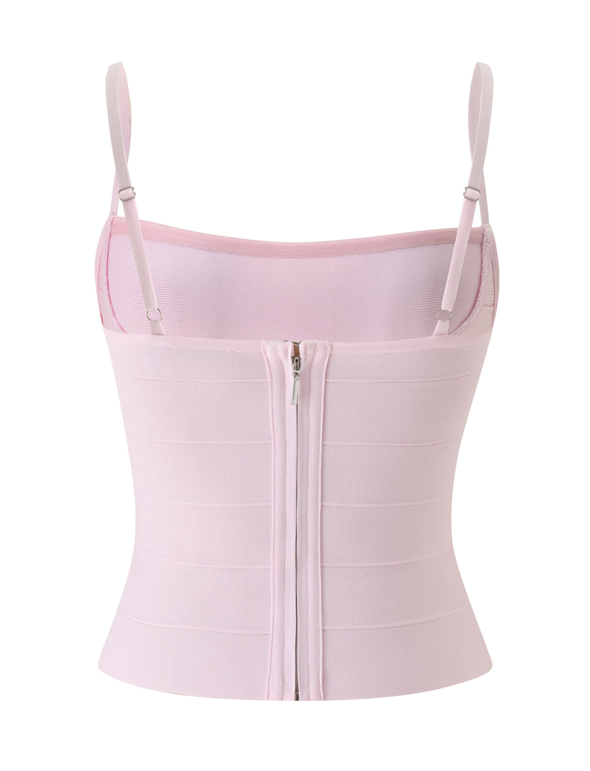 The TAHNIA BANDAGE TOP in Ballet Pink by TIGERMIST is a light pink, fitted, sleeveless top featuring adjustable spaghetti straps and a visible central back zipper. Crafted from smooth, structured fabric for a bodycon fit that flatters your silhouette, this baby pink top channels subtle corset-inspired details for a chic and modern look.
