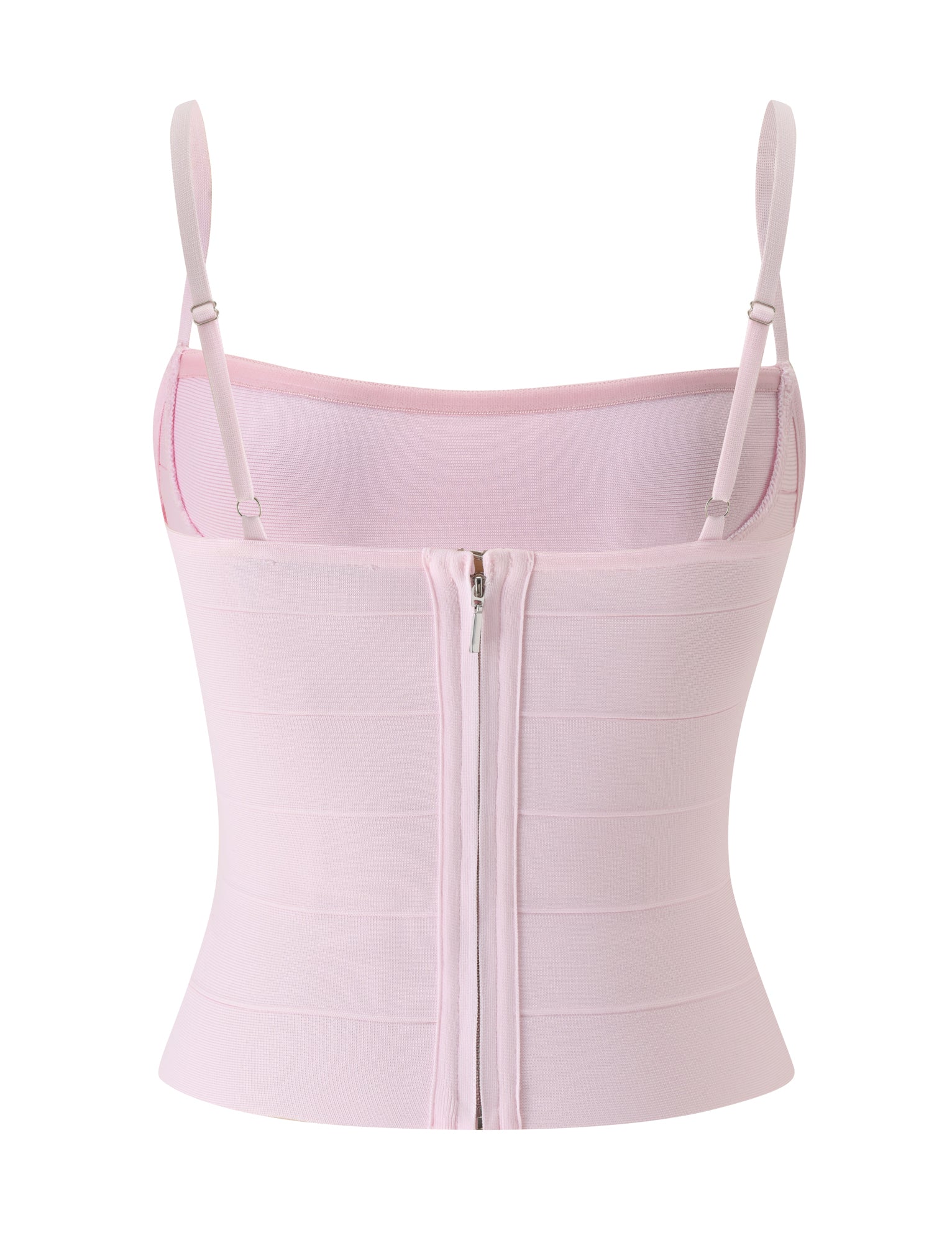 The TAHNIA BANDAGE TOP in Ballet Pink by TIGERMIST is a light pink, fitted, sleeveless top featuring adjustable spaghetti straps and a visible central back zipper. Crafted from smooth, structured fabric for a bodycon fit that flatters your silhouette, this baby pink top channels subtle corset-inspired details for a chic and modern look.