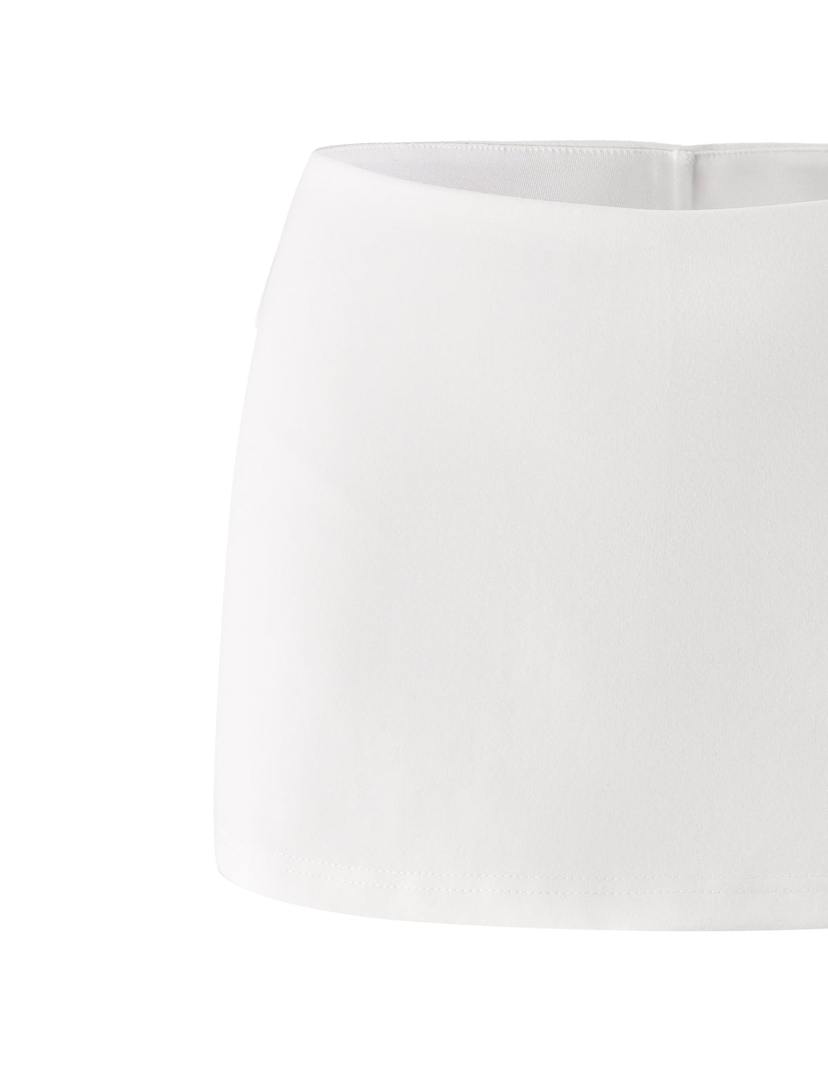 The VICTORIA MINI SKORT - IVORY by TIGERMIST features a clean, minimalist design with a smooth finish and no visible patterns or embellishments, showcased here against a white background.