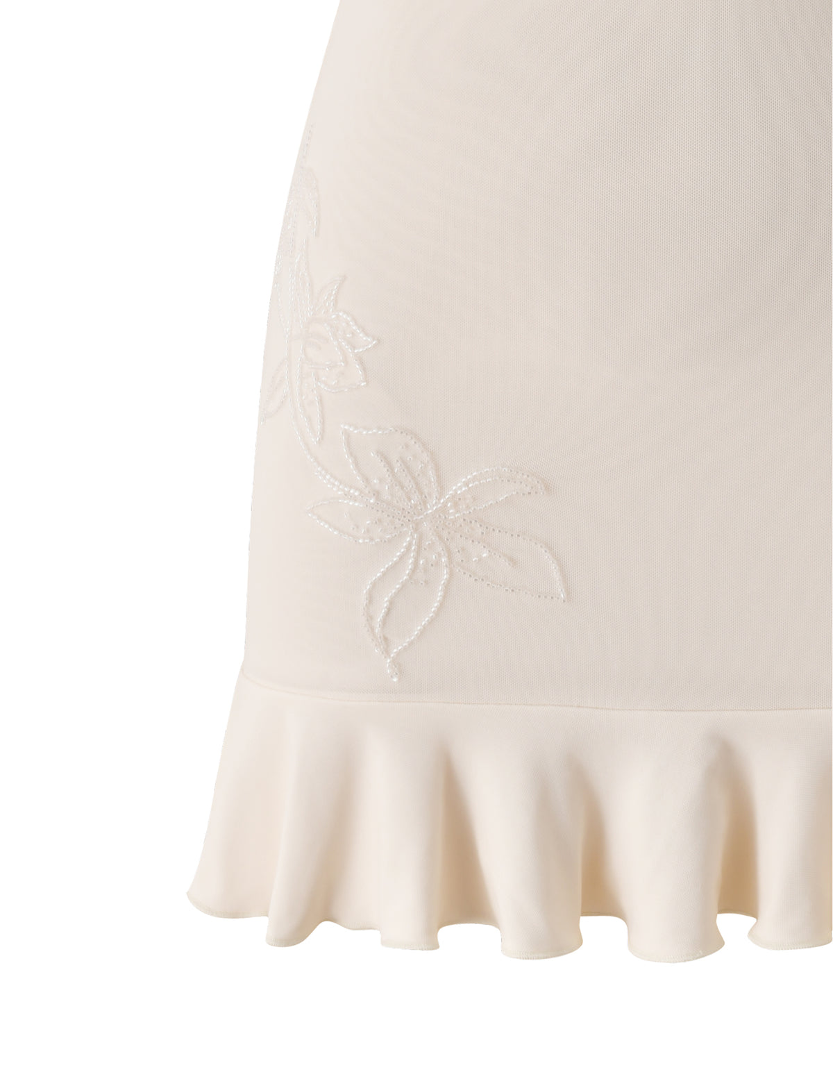Close-up of the TIGERMIST GIULIA MINI DRESS in ivory, featuring embroidered floral designs and a ruffled hem—perfect as a romantic bridal shower dress.