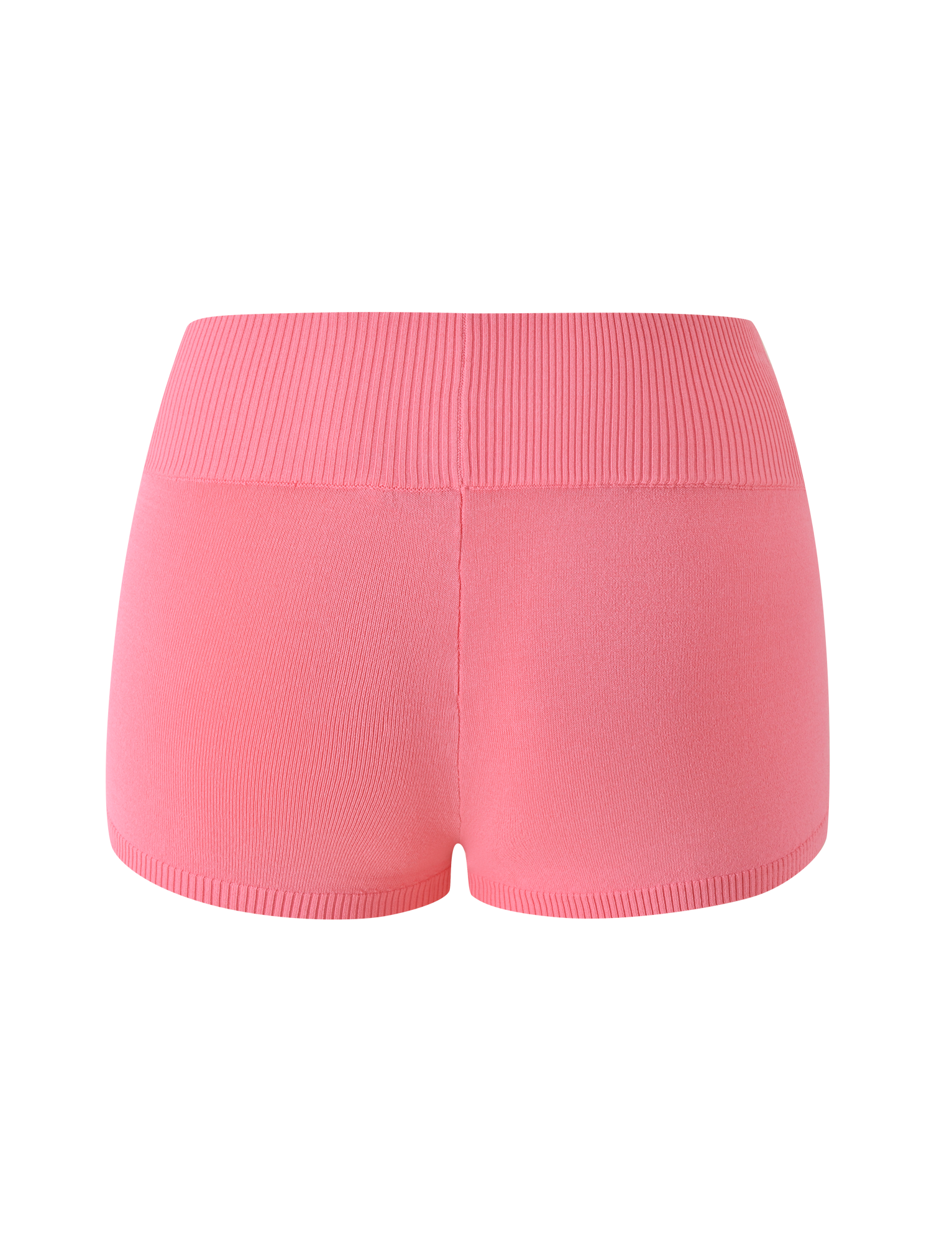 The PARKER KNIT MICRO SHORT in Coral by TIGERMIST is shown from the back, highlighting its high-waisted, seamless design with a ribbed waistband and smooth, stretchy fine knit fabric. These shorts feature a simple solid color and a flattering bodycon fit for a snug, comfortable feel.