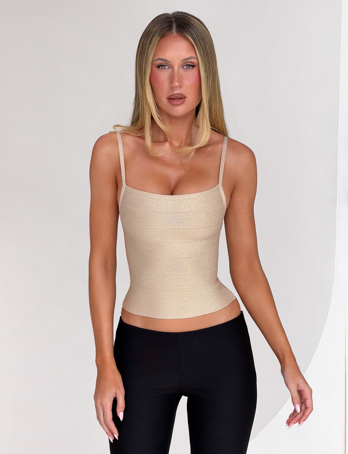Model wearing the Tiger Mist Midori Shimmer Bandage Top in Gold Sparkle