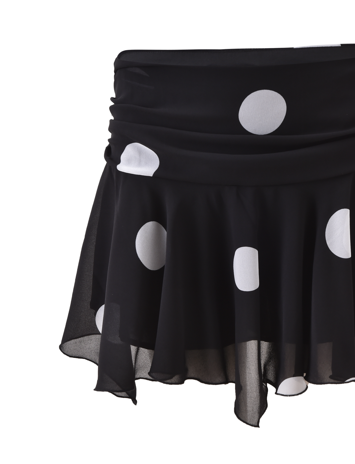 The AYDIN MINI SKIRT by TIGERMIST is a black, semi-sheer chiffon mini skirt with large white polka dots, a draped waistband, and a flowy silhouette, shown against a plain white background.