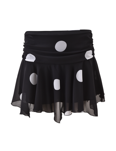 The AYDIN MINI SKIRT by TIGERMIST is a black chiffon mini with large white polka dots, a ruched waistband, layered flowy design, and an asymmetrical hem for a playful, modern vibe.