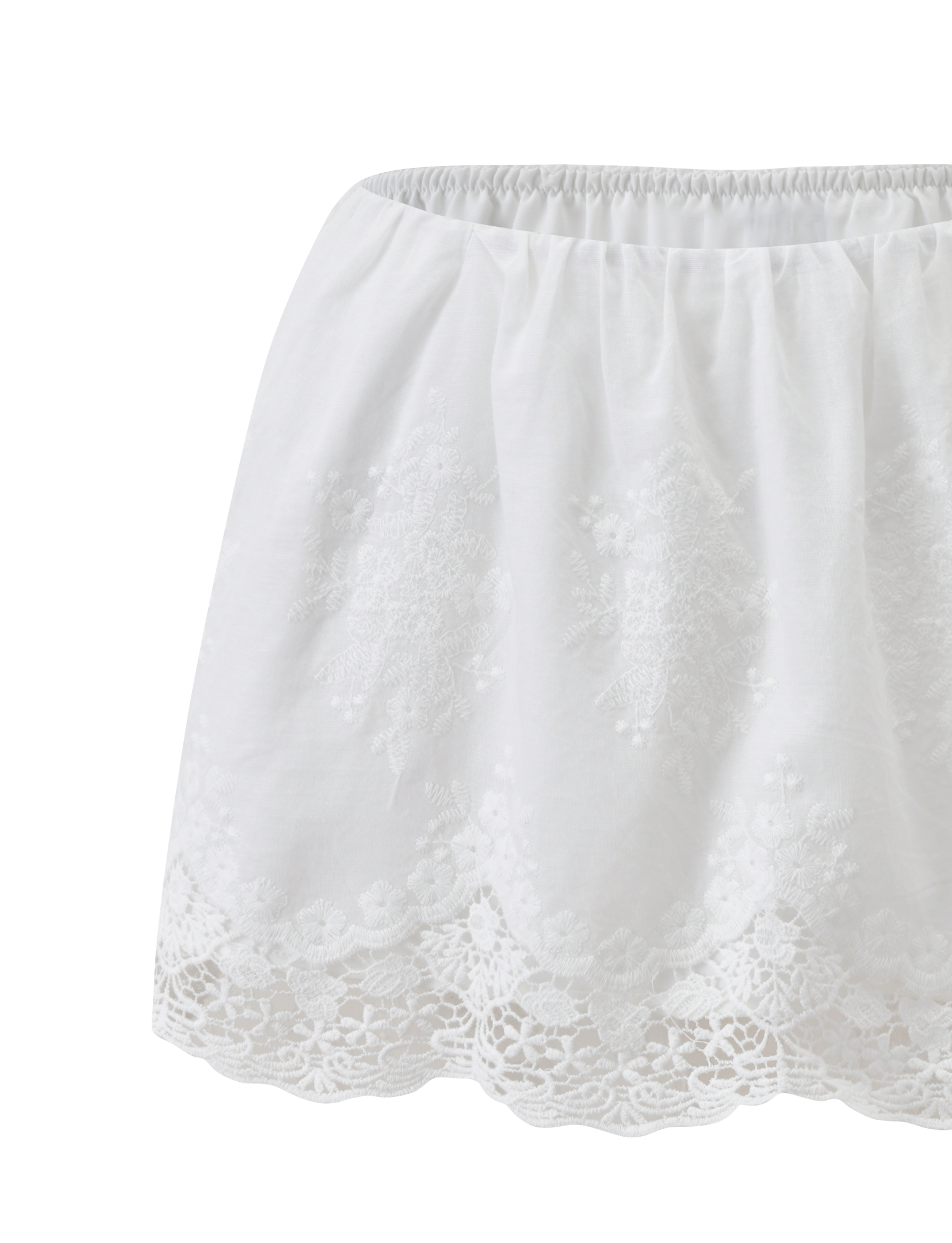 The CAILEIGH MINI SKIRT by TIGERMIST in white features an elastic waistband and detailed lace trim at the hem, shown against a plain white background.