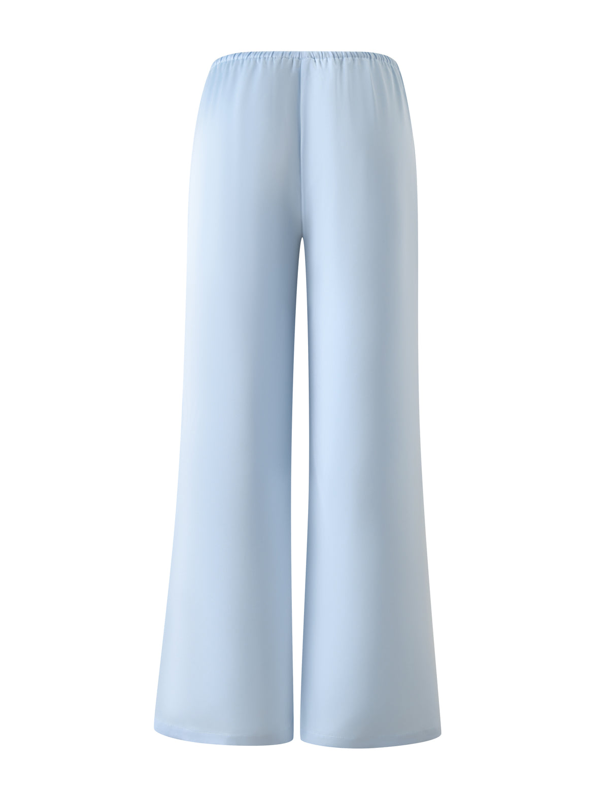 The MAURA PANT - SKY by TIGERMIST features wide legs, a high-waisted design, and an elastic adjustable waistband in soft sky blue fabric. Shown on a plain white background.