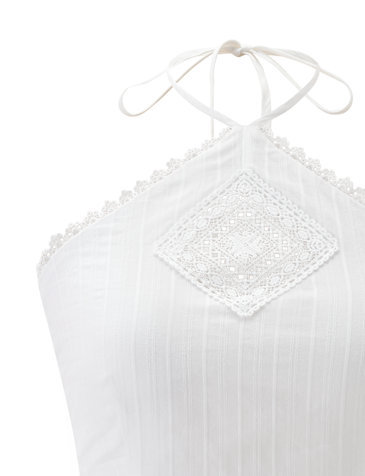 The LILETH TOP - WHITE by TIGERMIST is a white halter neck top in textured woven fabric, featuring lace trim along the neckline, a diamond lace panel at the front, subtle vertical stripes, and scallop eyelet trims.