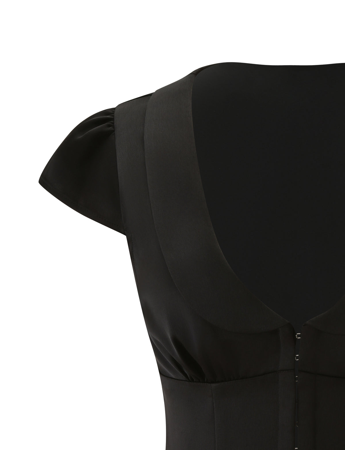 Close-up of the back of the black MAURA TOP, featuring princess seams and a wide, scooped neckline that fastens with small metal hooks.