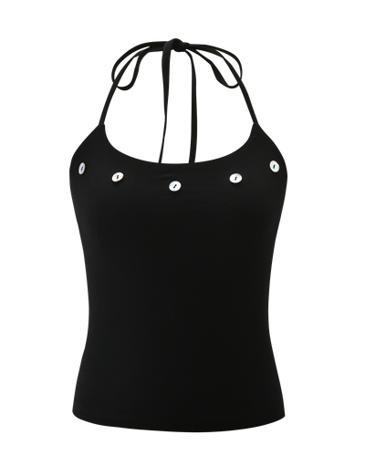The PIPPA TOP - BLACK by TIGERMIST is a halter neck tank featuring thin tie straps, a scoop neckline, and five silver grommet-style eyelets in a horizontal line across the chest.