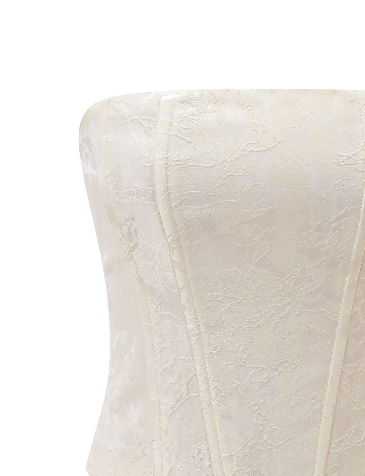 The LANIA CORSET TOP - CREAM by TIGERMIST features visible boning, subtle floral jacquard, and a strapless off-white lace finish, shown in close-up against a plain white background.