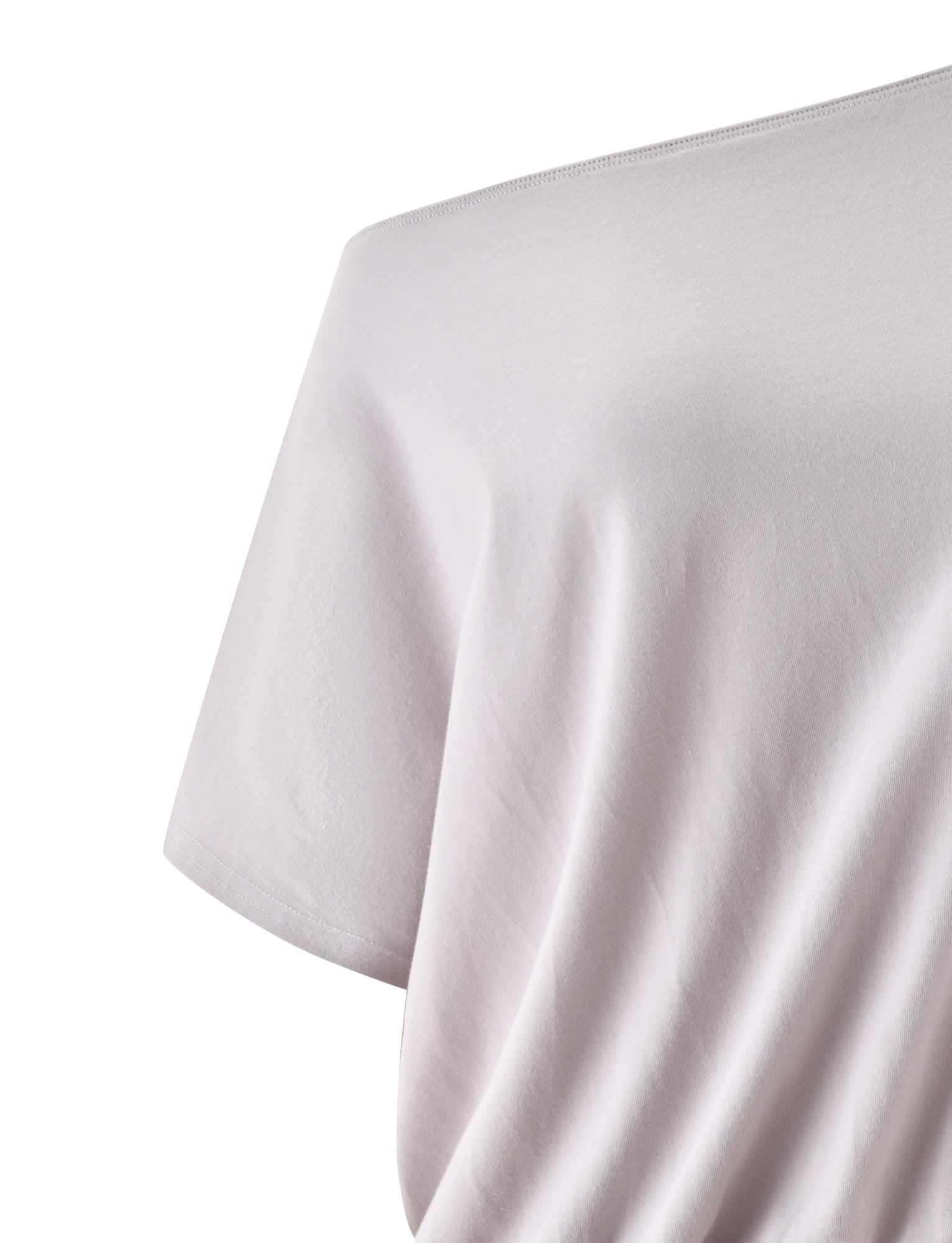 A close-up of the DRELLA TOP in Dove Grey by TIGERMIST, highlighting the fabric texture and upper shoulder area, with subtle hints of a blouson silhouette for added softness.