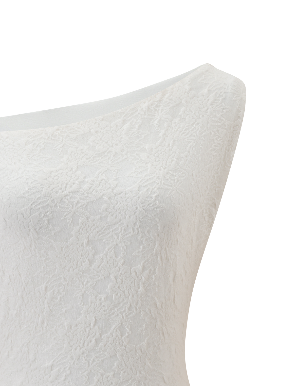 The TIGERMIST MAVEN LACE TOP in ivory, featuring a sleeveless design with an asymmetrical neckline and cropped hemline, is shown close-up on a mannequin against a plain white background.