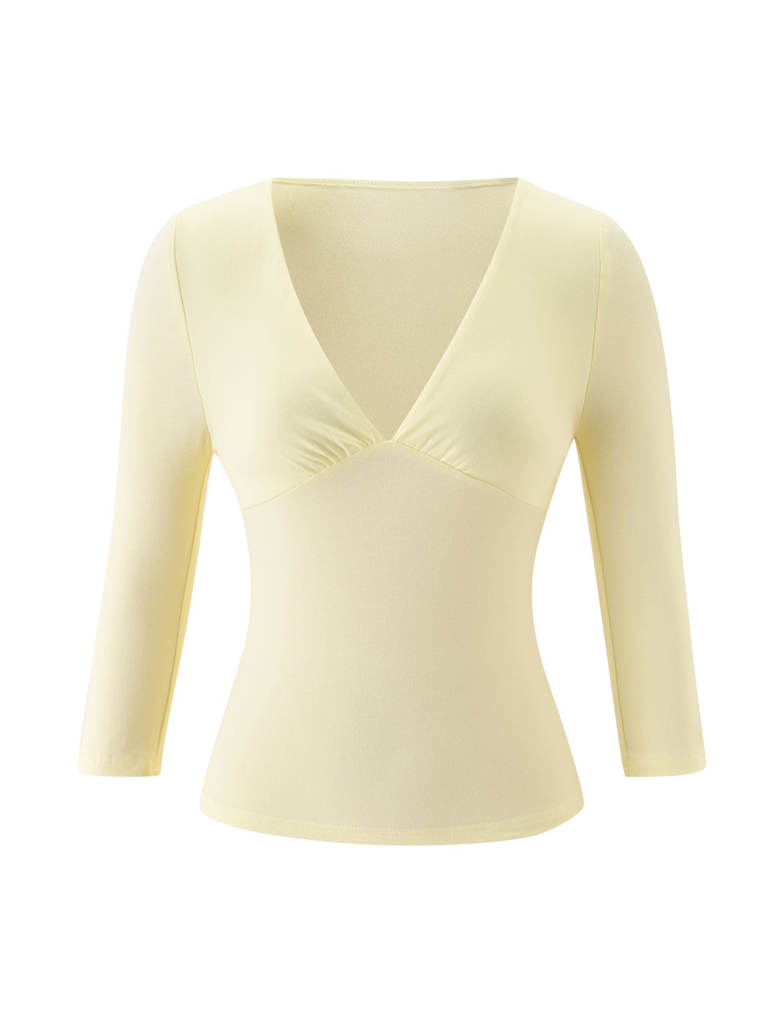 The SANDI TOP by TIGERMIST is a butter yellow, long-sleeve, fitted women's brunch top featuring a deep V-neckline and delicate gathering under the bust. Crafted from smooth, stretchy fabric.