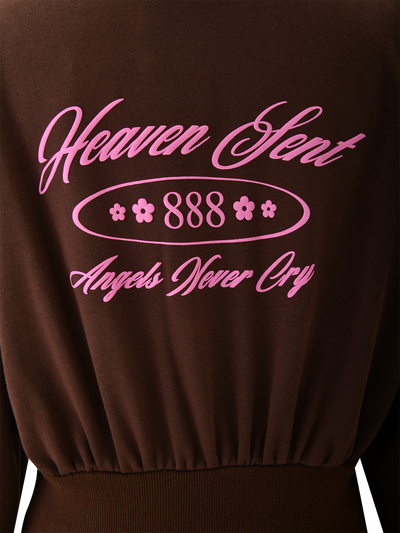 Back of the TIGERMIST MERRYN HOODIE - CHOCOLATE, featuring pink puff print "Heaven Sent 888 Angels Never Cry" with flower icons above an elastic waistband.