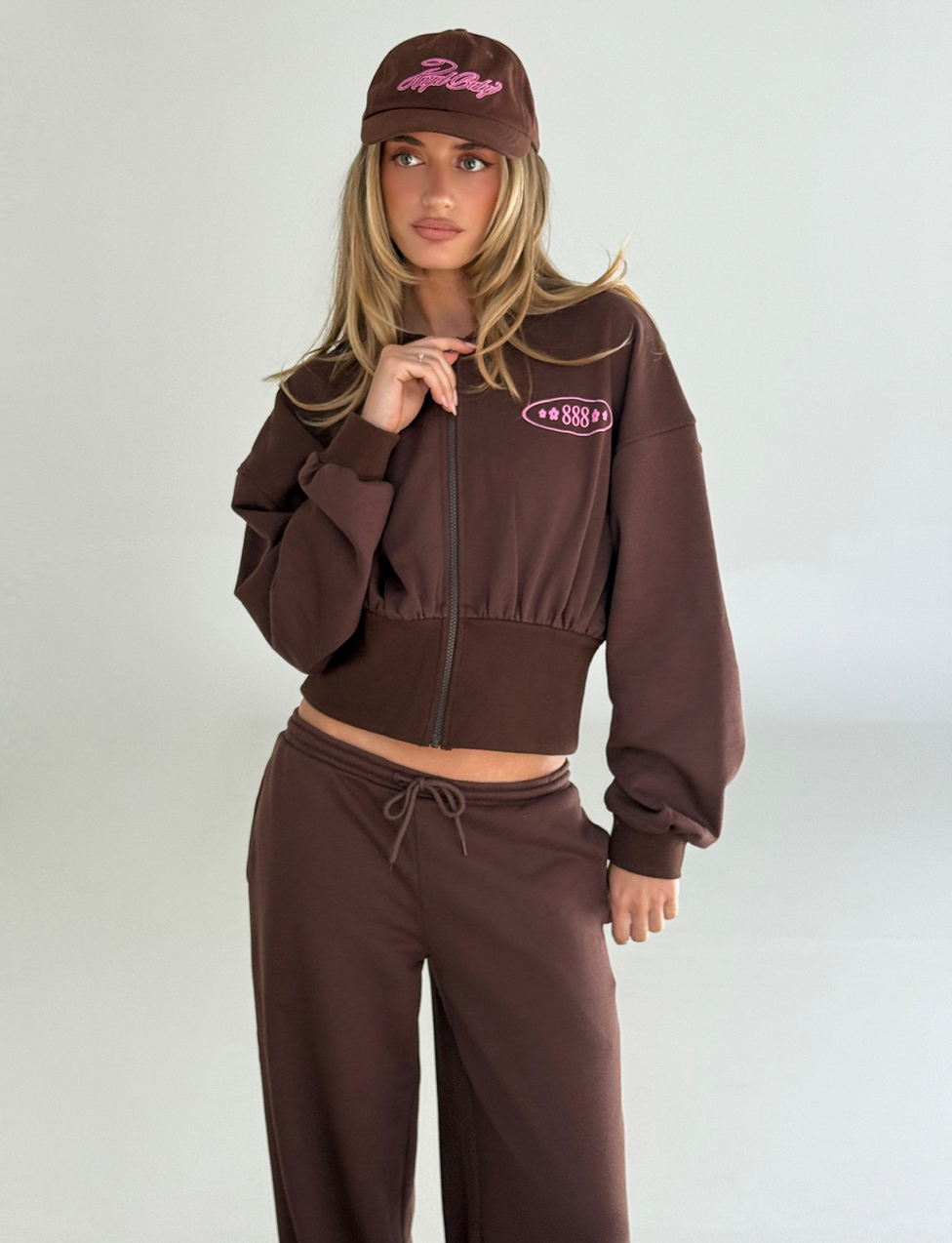 A woman wearing the TIGERMIST MERRYN HOODIE in chocolate.