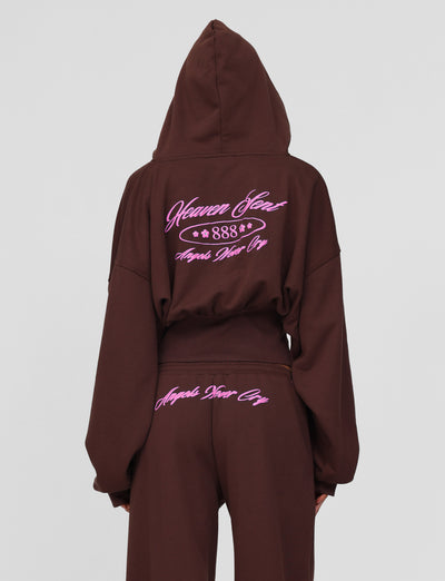 A person wears the TIGERMIST MERRYN HOODIE in chocolate, featuring pink custom puff print text on the back reading "Heaven Sent 888" and "Angels Never Cry"; matching pants have "Angels Never Cry" embroidered below the waistband.