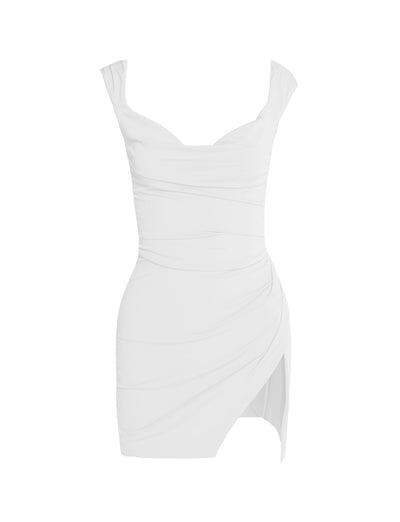 The JOSLIN DRESS - WHITE from TIGERMIST is a white, sleeveless, bodycon dress featuring ruched details. It showcases a sweetheart neckline and an asymmetrical hemline, with one side of the hem being longer than the other. The slightly gathered fabric creates a draped effect.