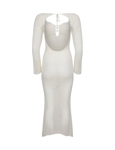The MACAULEY DRESS - WHITE : CREAM from TIGERMIST showcases a form-fitting silhouette and features a distinctive open back design with a tie closure. A cut-out detail near the shoulder blades adds flair, complemented by its soft A-line shape that ends in a mid-calf length hem.
